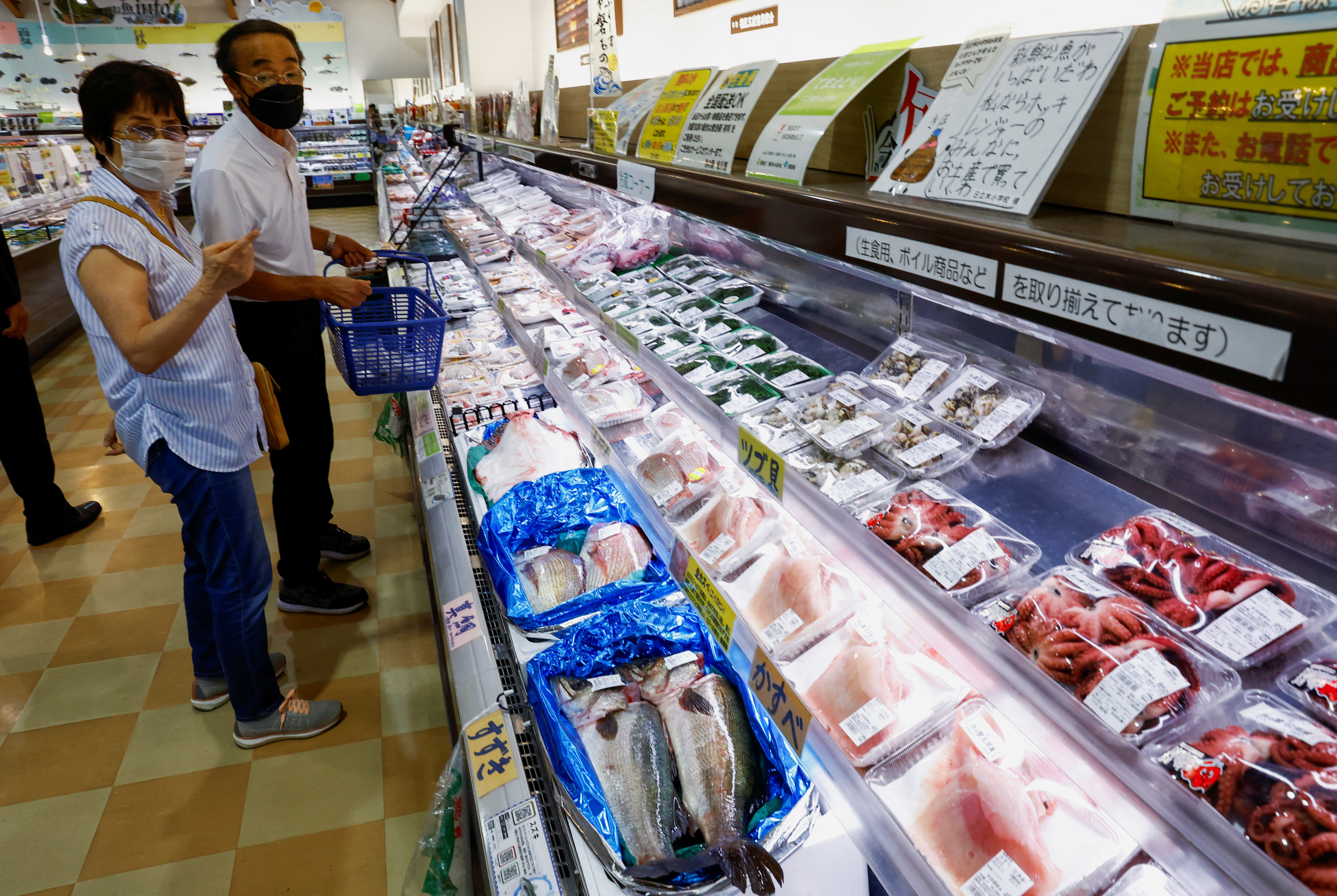 Customers browse through locally caught seafood at the Hamanoeki Fish Market and Food Court in Soma, Fukushima Prefecture