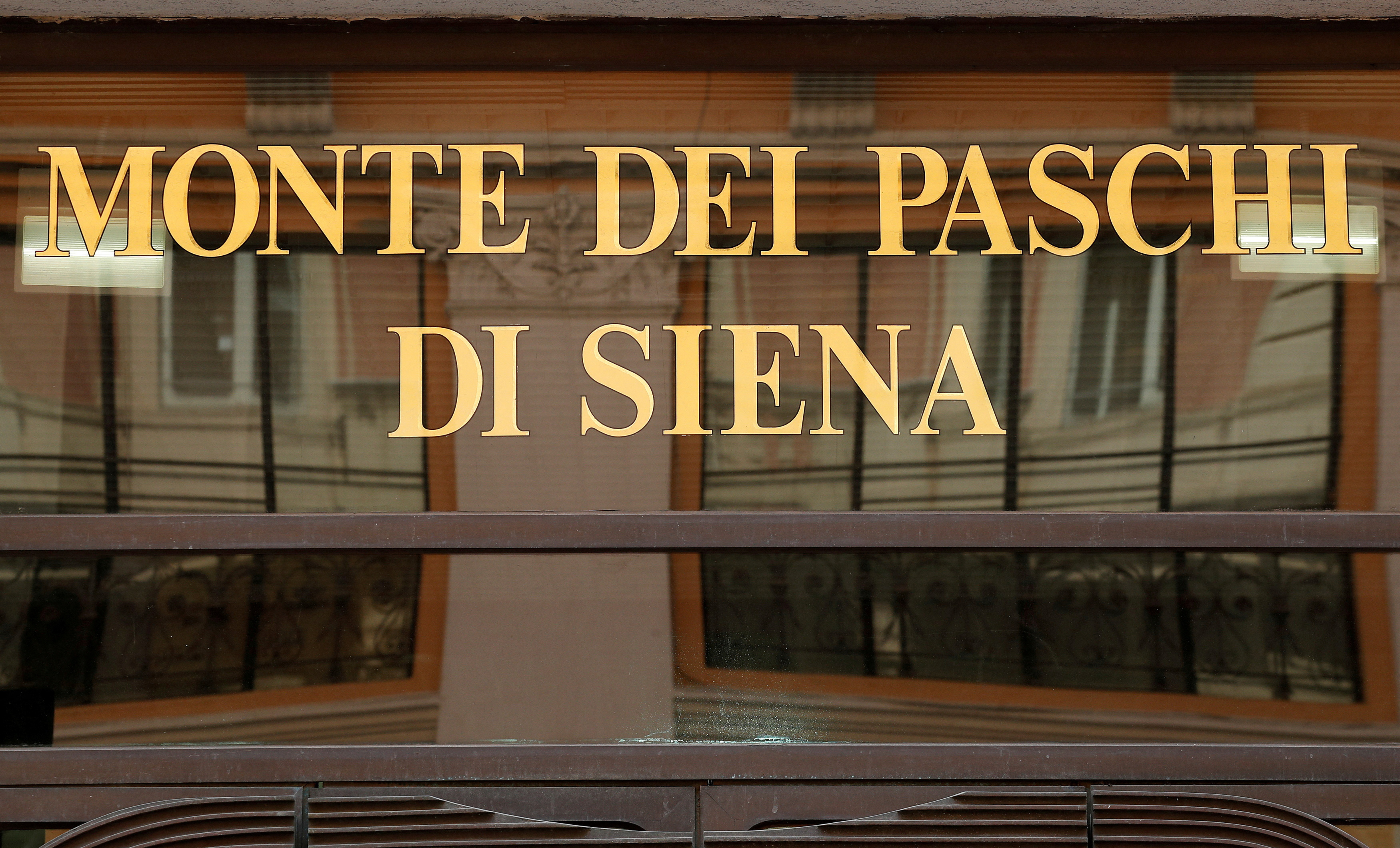 FILE PHOTO: A sign of the Monte dei Paschi bank is seen in Rome