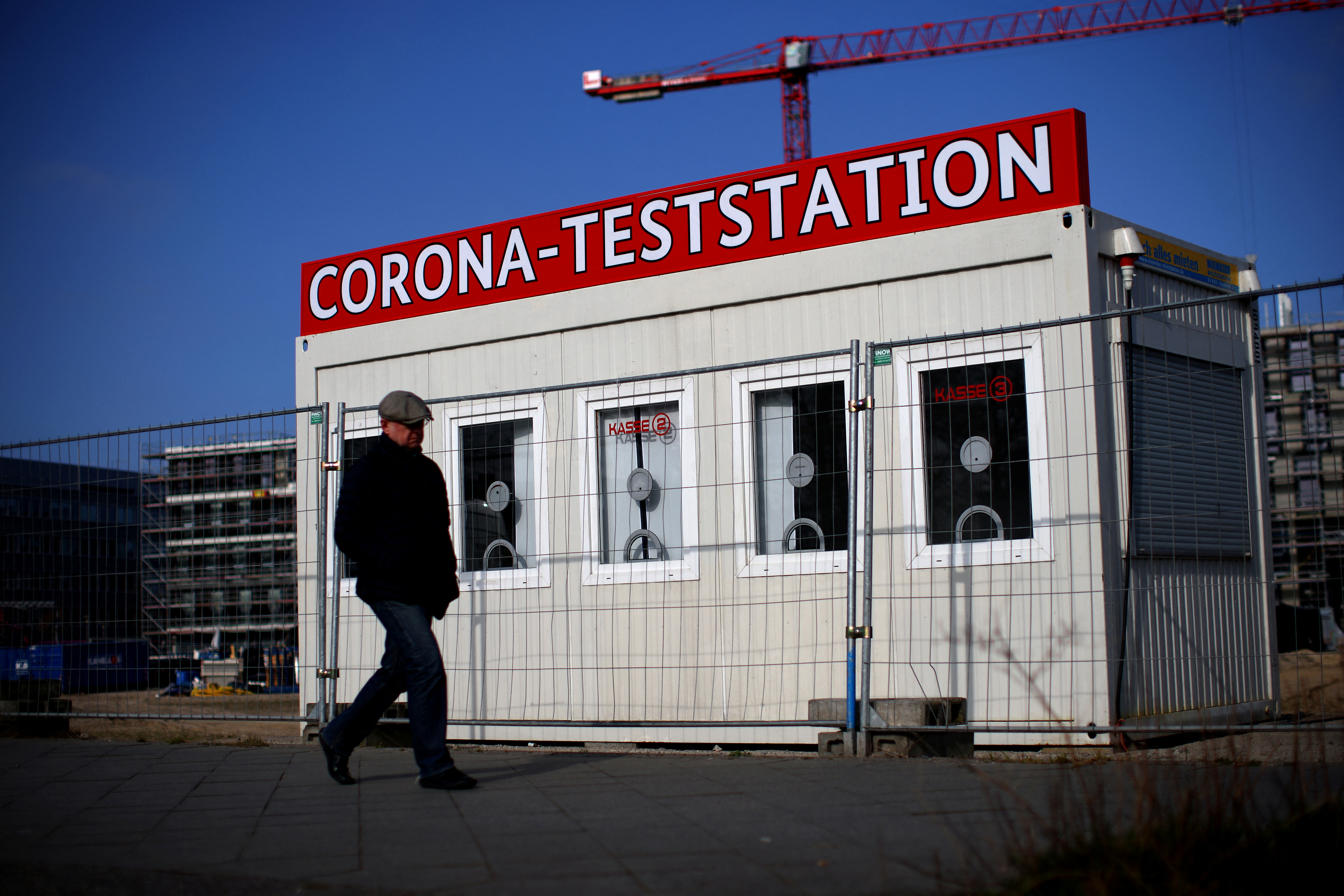 A person walks past a closed COVID-19 testing station in Berlin