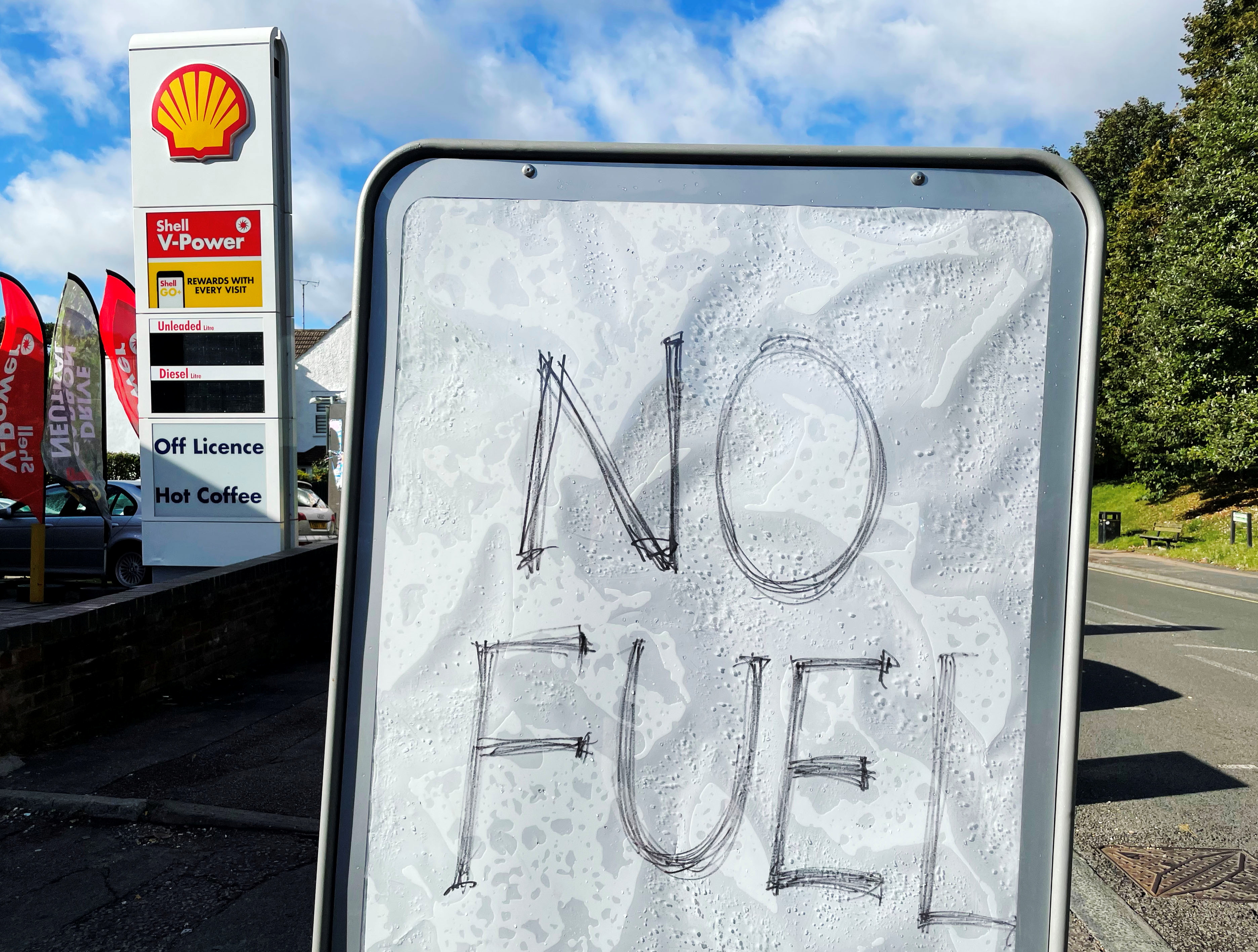 A sign showing customers that fuel has run out is pictured at a petrol station