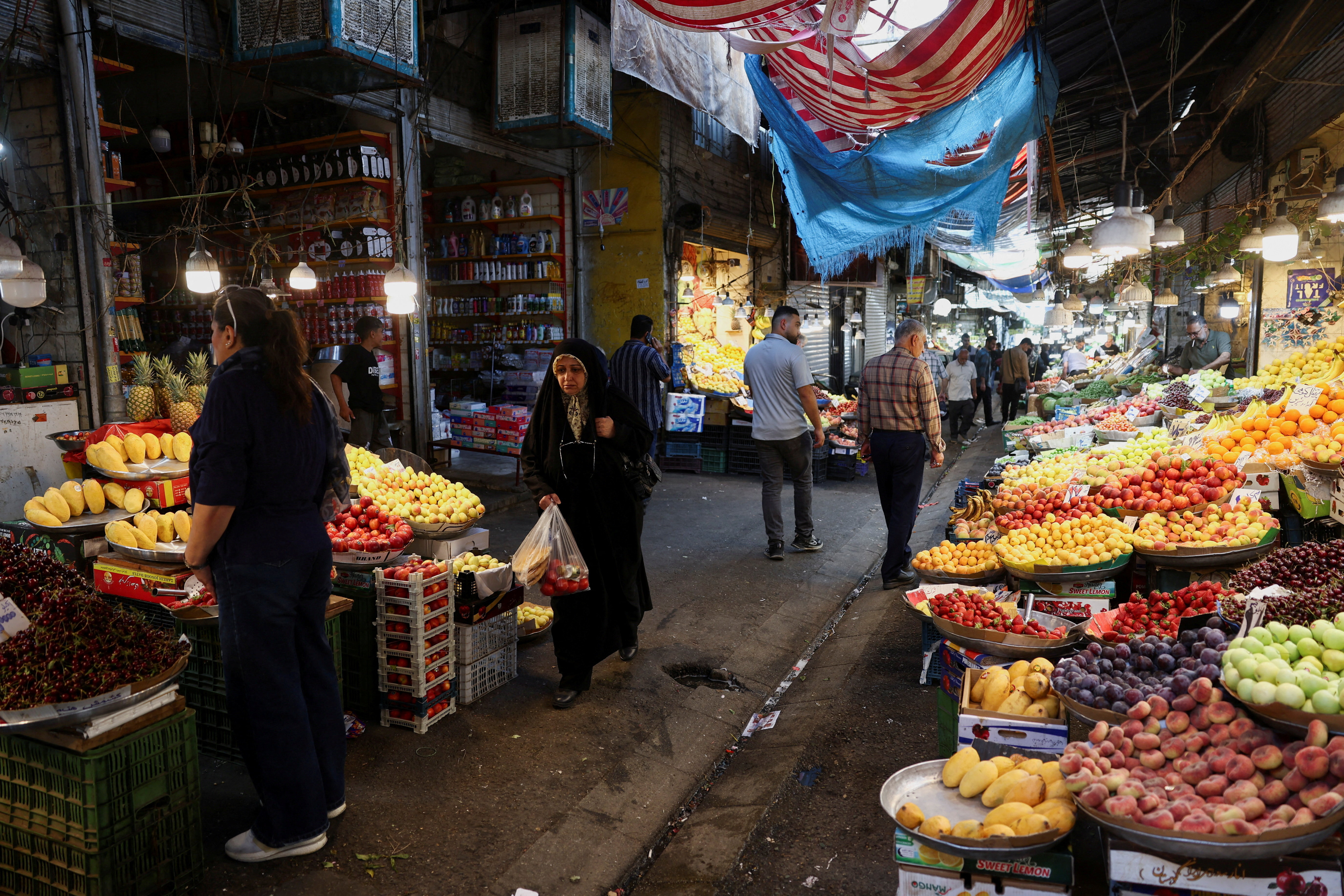 People walk in a local market in Tehran, Iran on June 11, 2026. &mdash; WANA via Reuters/