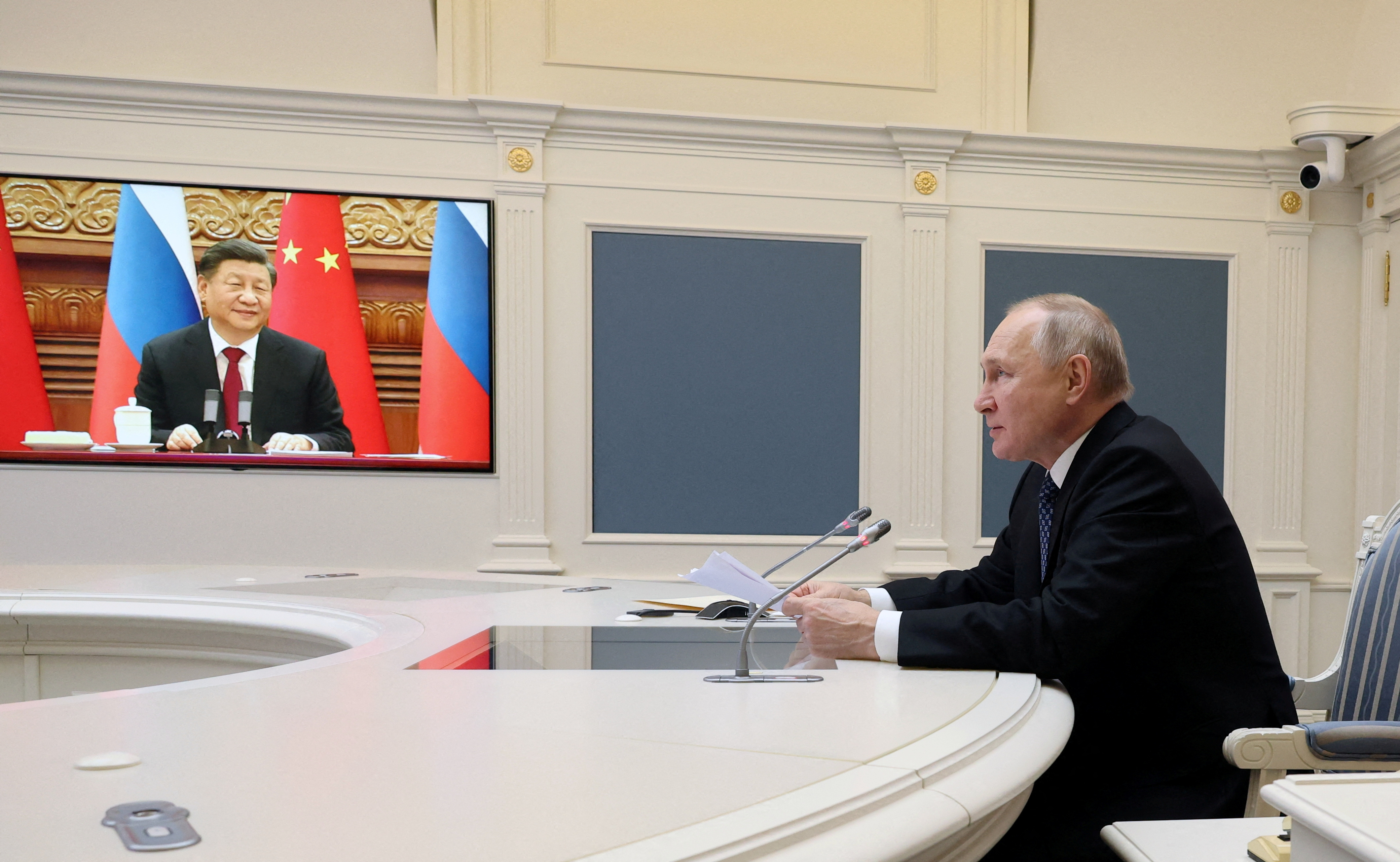 Putin and Xi hold talks via videolink