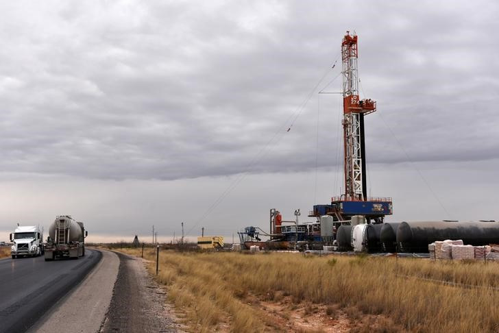 A drilling rig operates in the Permian Basin oil and natural gas producing area in Lea County