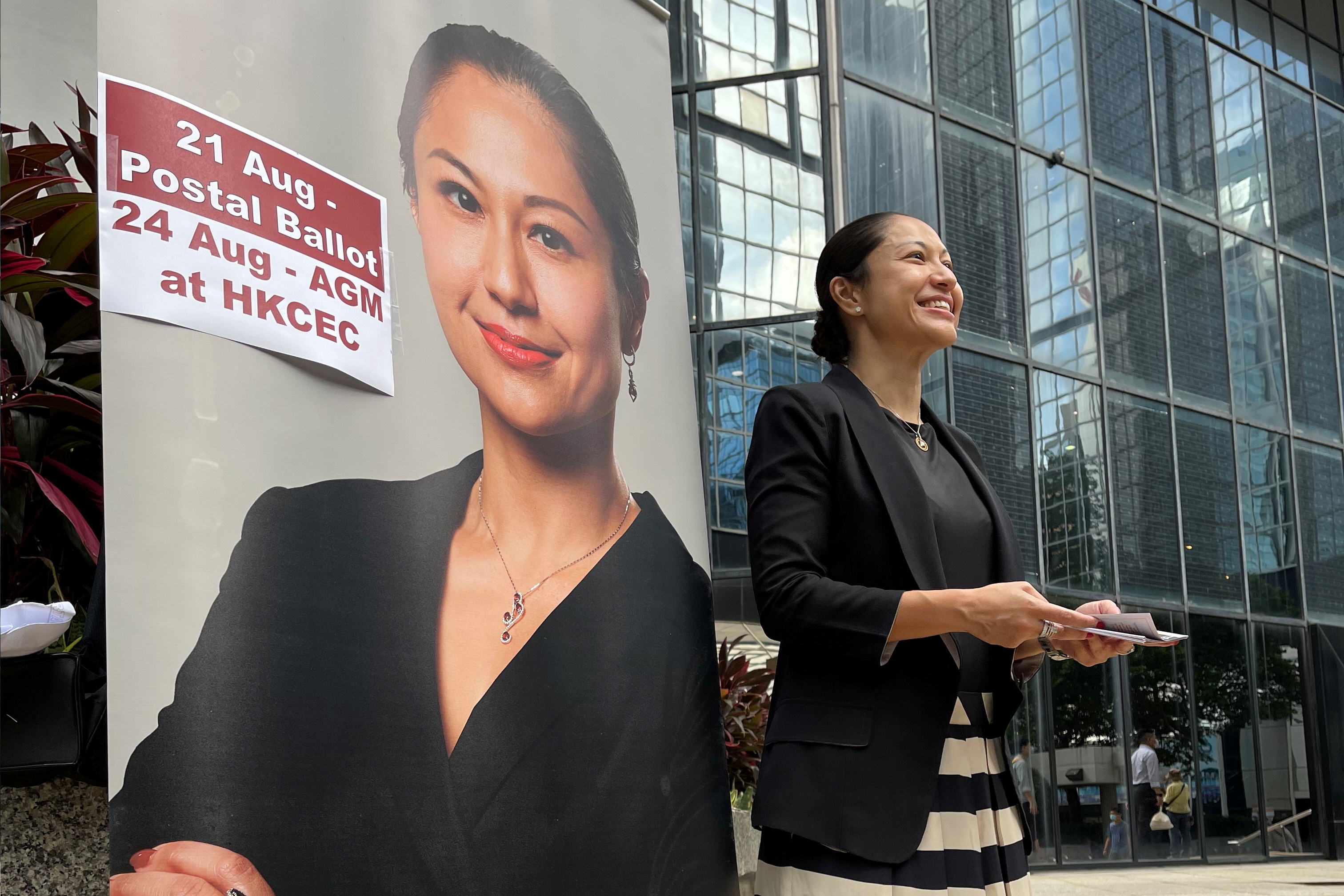 Selma Masood, a candidate for the Hong Kong Law Society's election to select new council members, hands out pamphlets outside the city's district court ahead of the election in Hong Kong, China August 12, 2021. REUTERS/James Pomfret