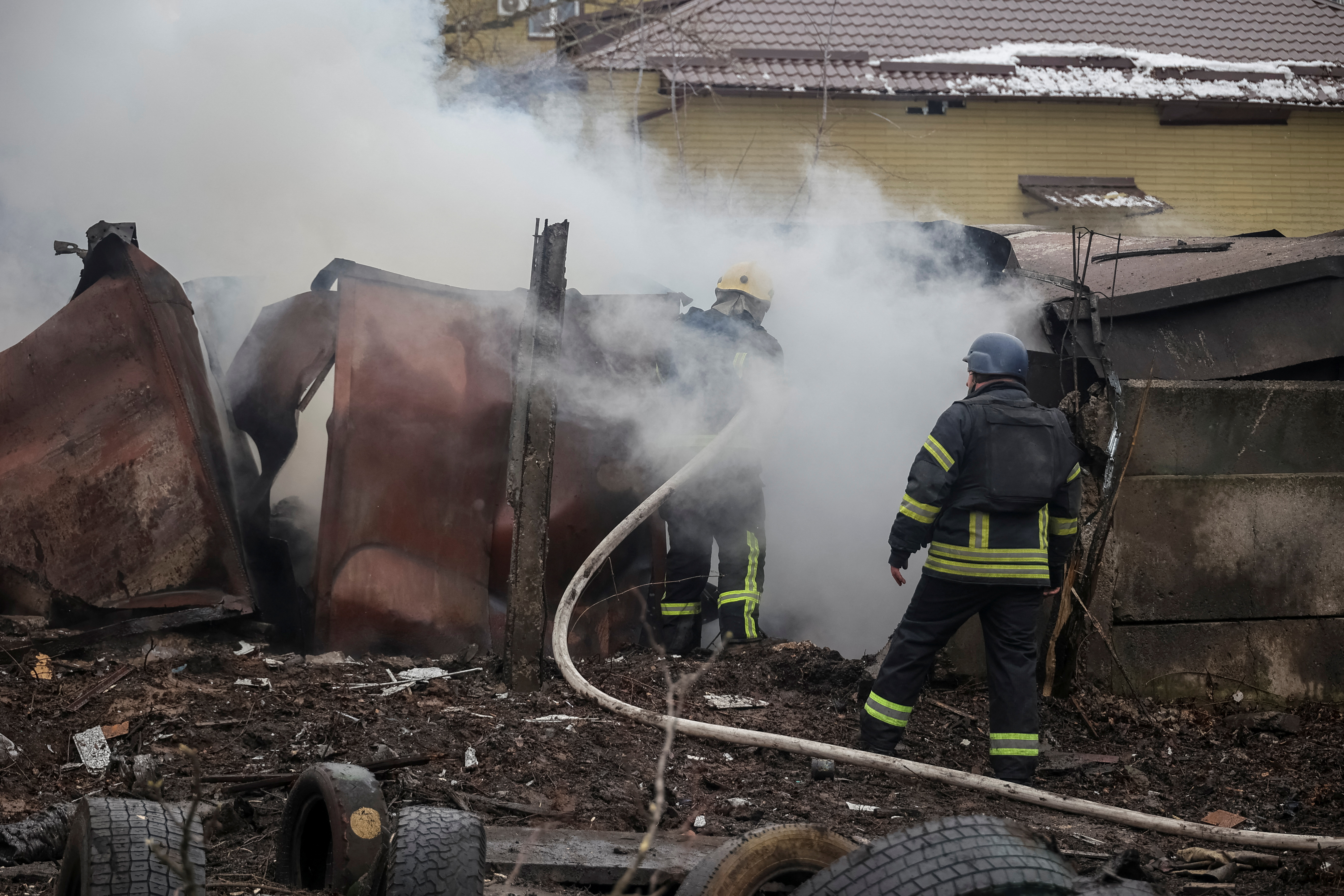 Rescuers work at a site after a Russian missile strike in Kramatorsk
