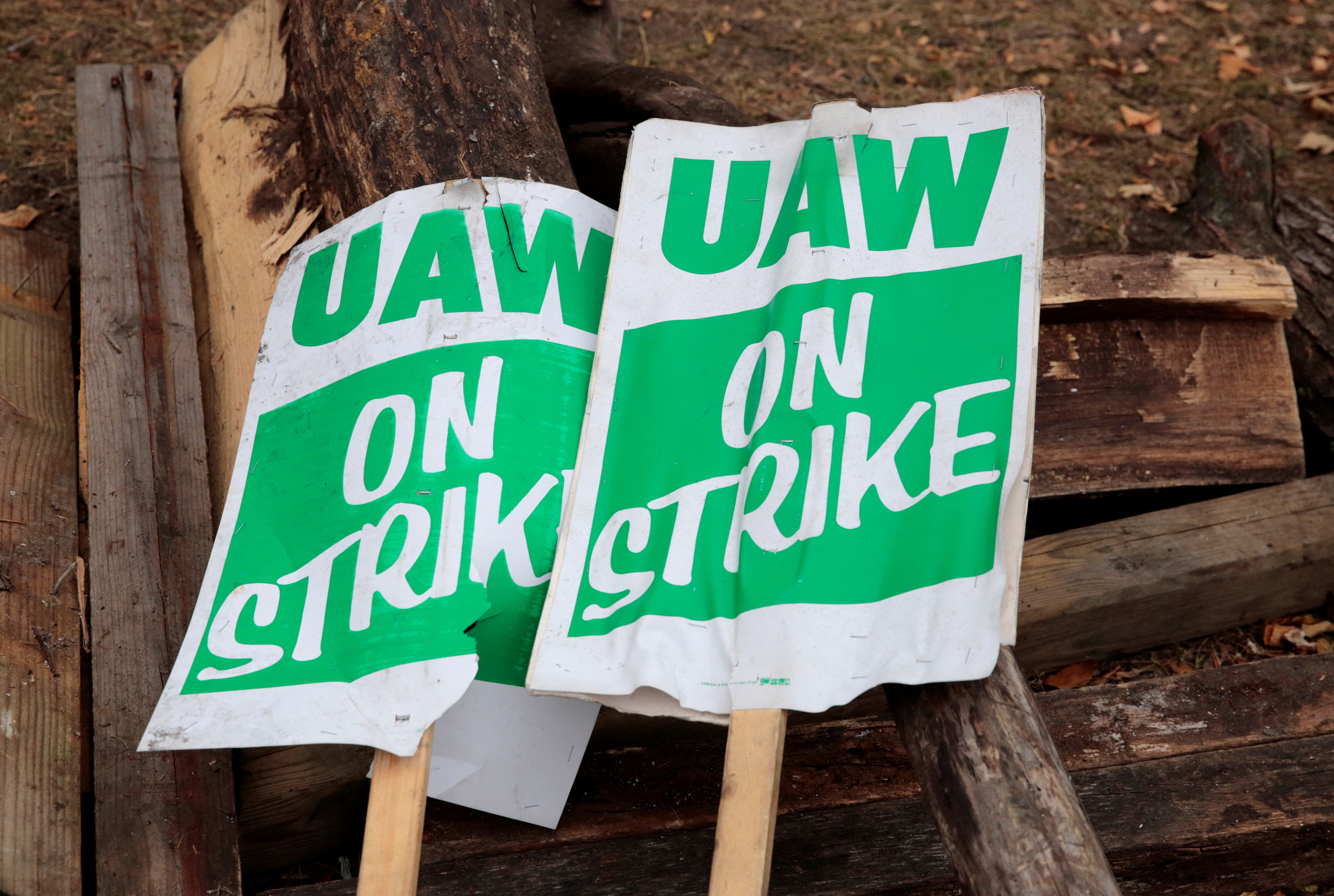 _busiFILE PHOTO: "UAW on strike" picket signs lay on a pile of wood outside the General Motors Detroit-Hamtramck Assembly in Hamtramck