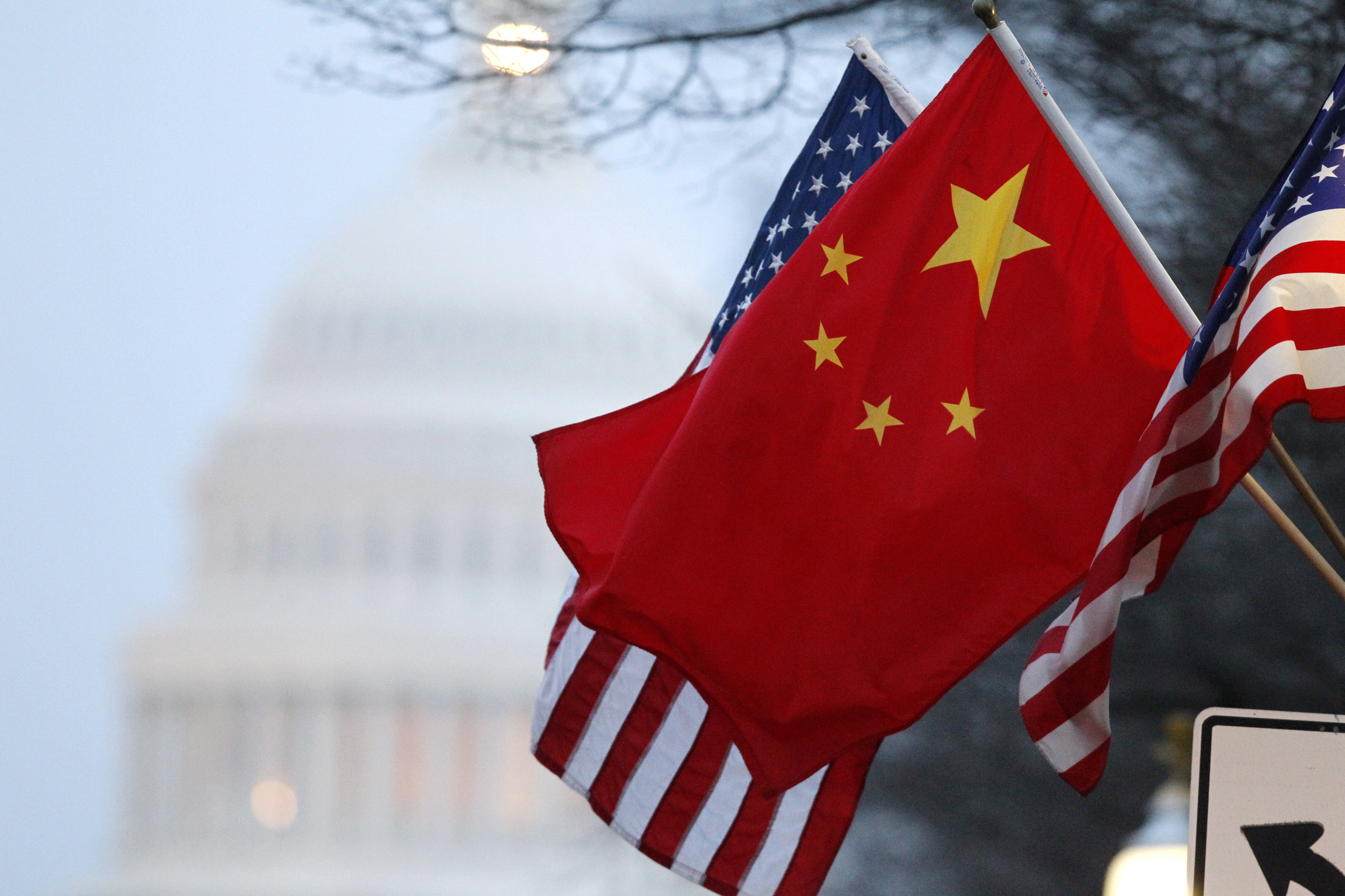 The People's Republic of China flag and the U.S. Stars and Stripes fly along Pennsylvania Avenue near the U.S. Capitol in Washington