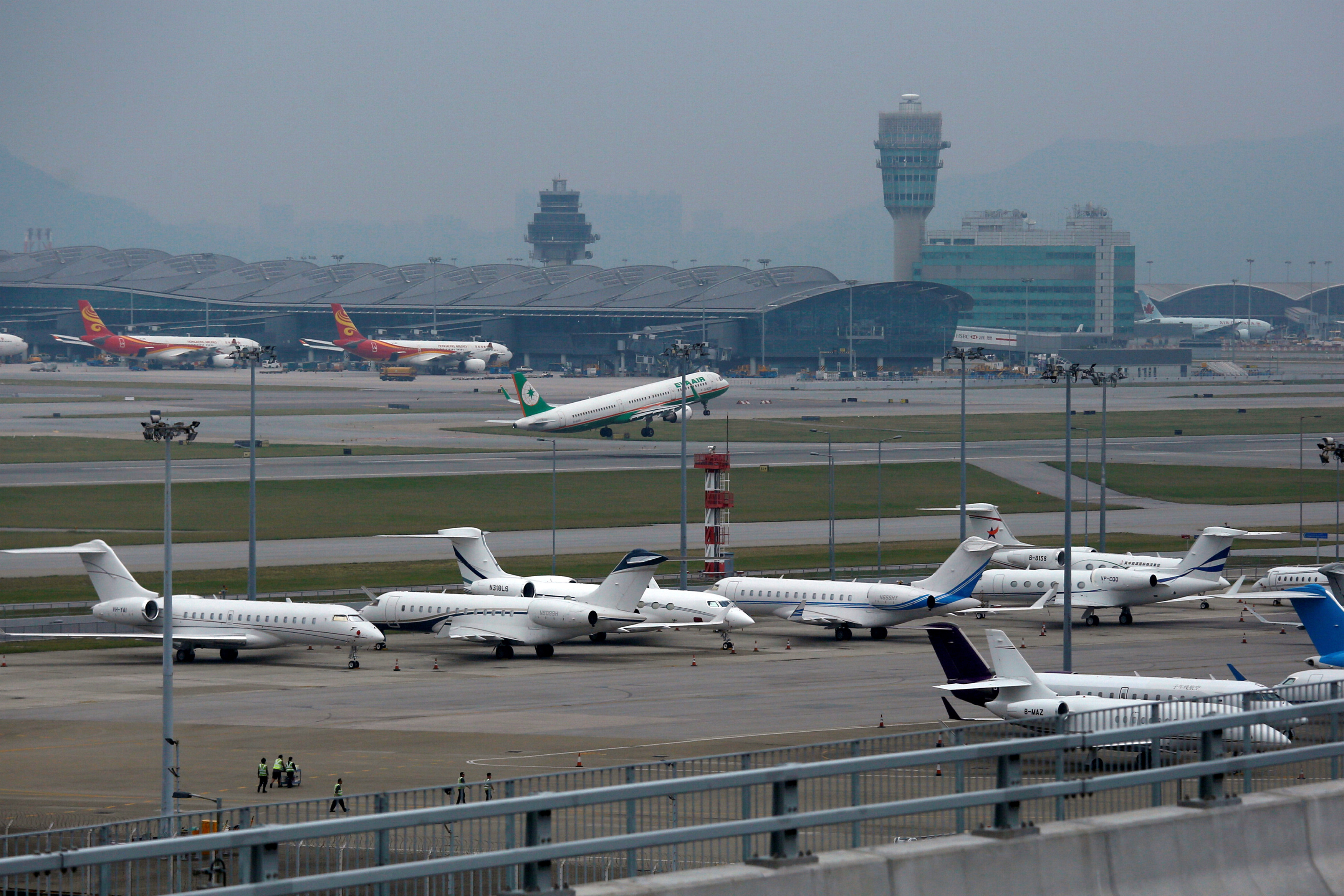 Business jets park at Hong Kong International Airport