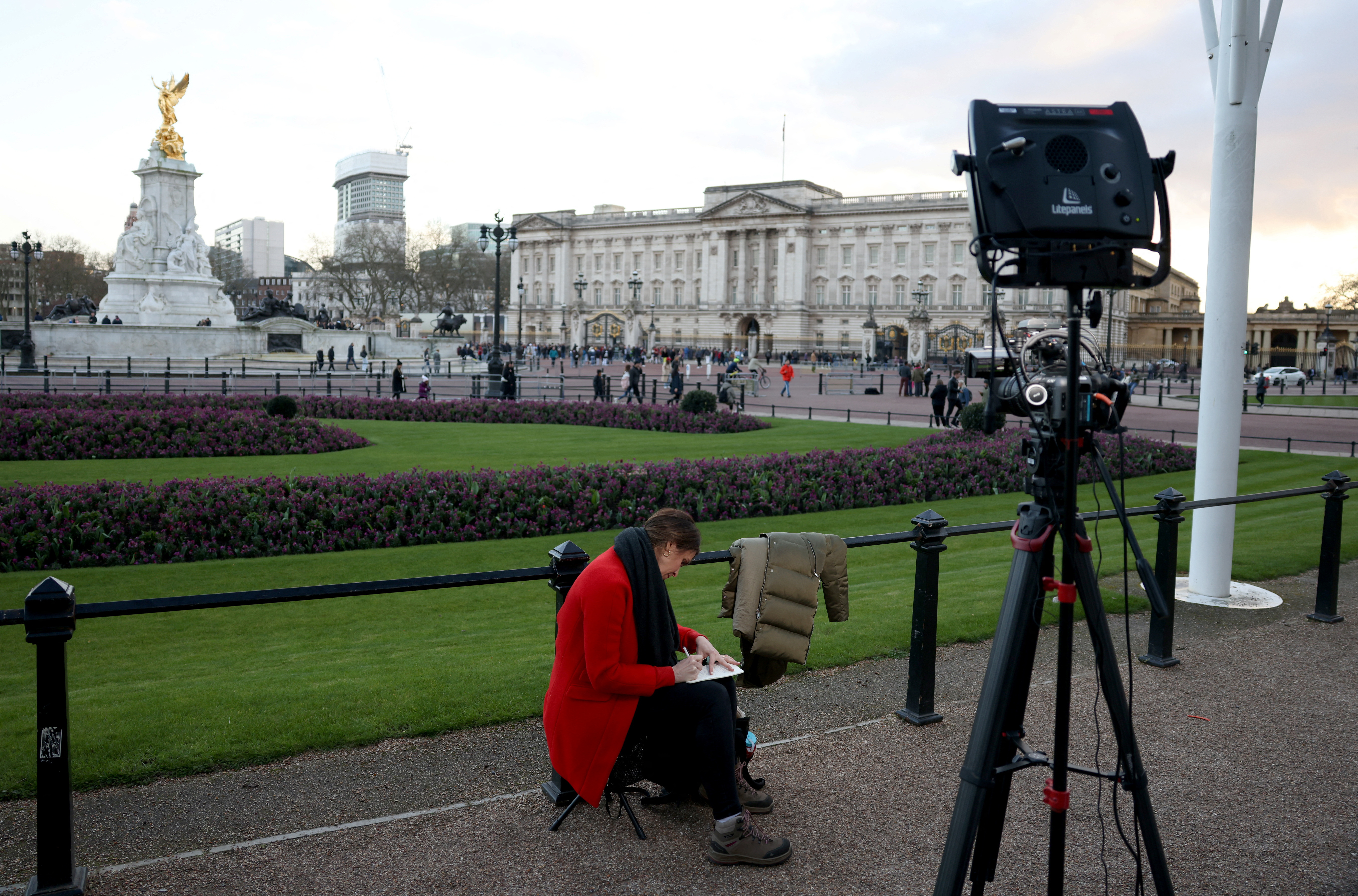 People gather outside Buckingham Palace in London