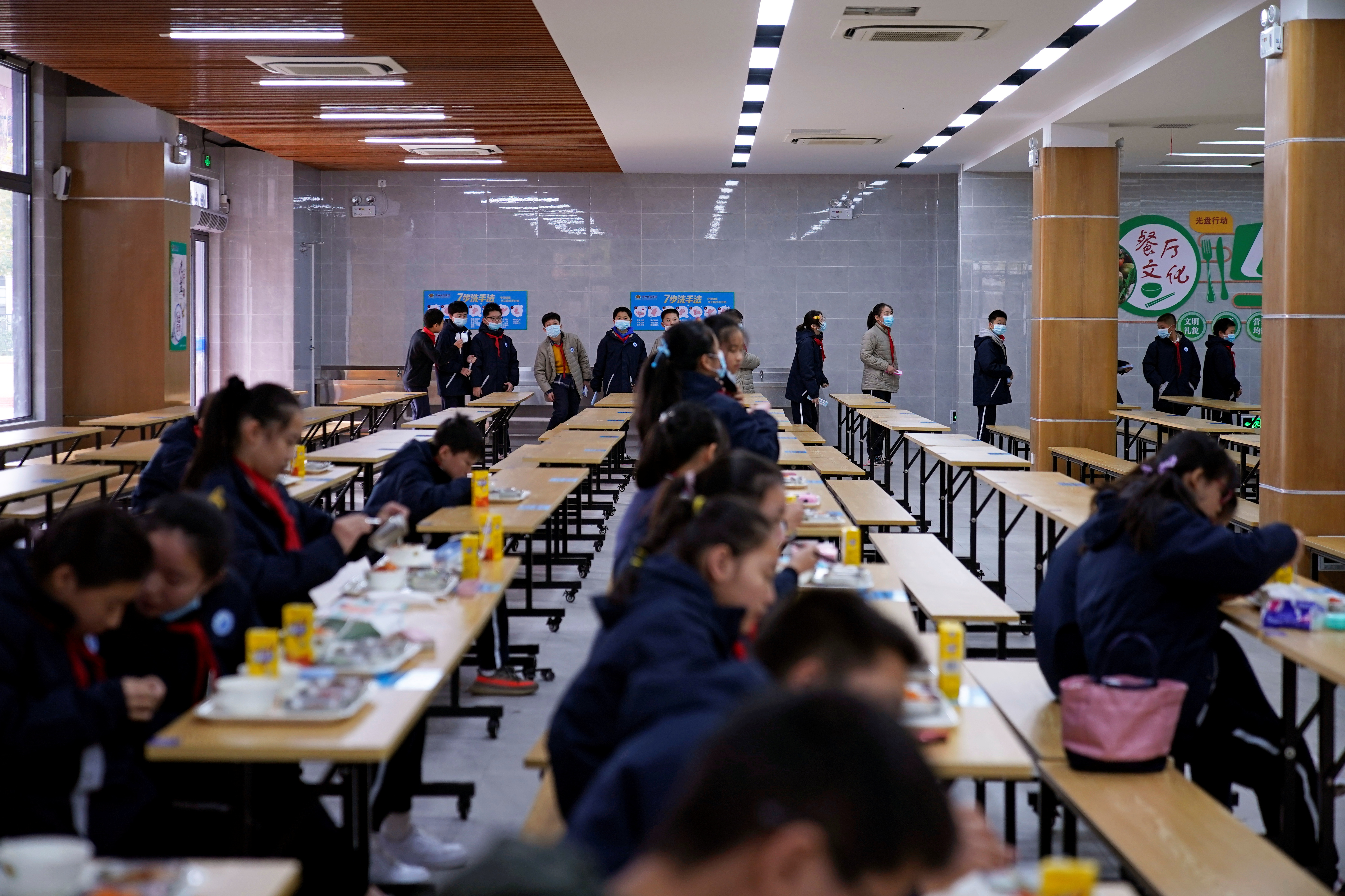 Students arrive at a restaurant for lunch at Minhang Experimental High School amid the global outbreak of the coronavirus disease (COVID-19) in Shanghai