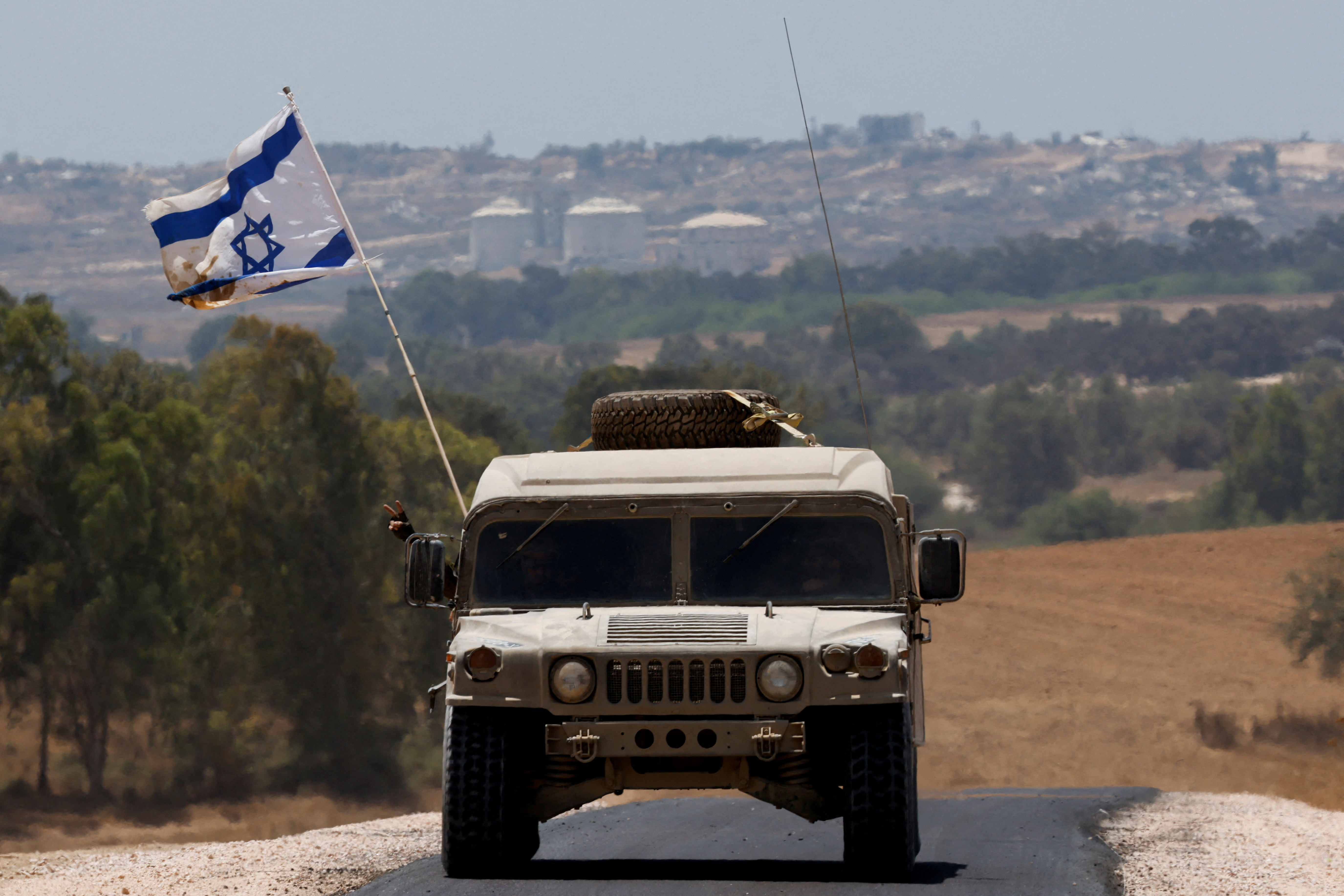 A military vehicle maneuvers near the Israel-Gaza border