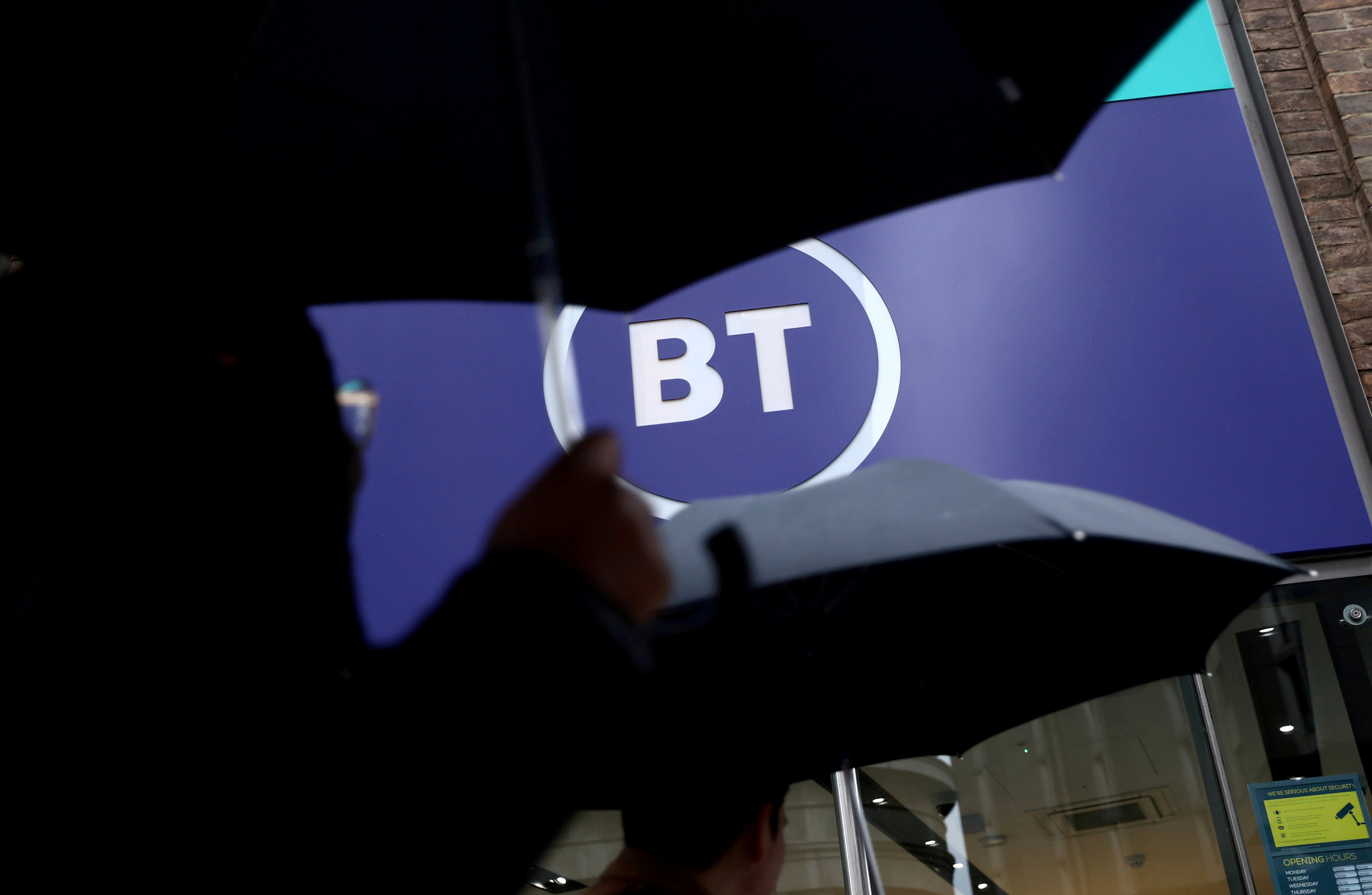 Logo of British Telecom (BT) is displayed outside a store in London