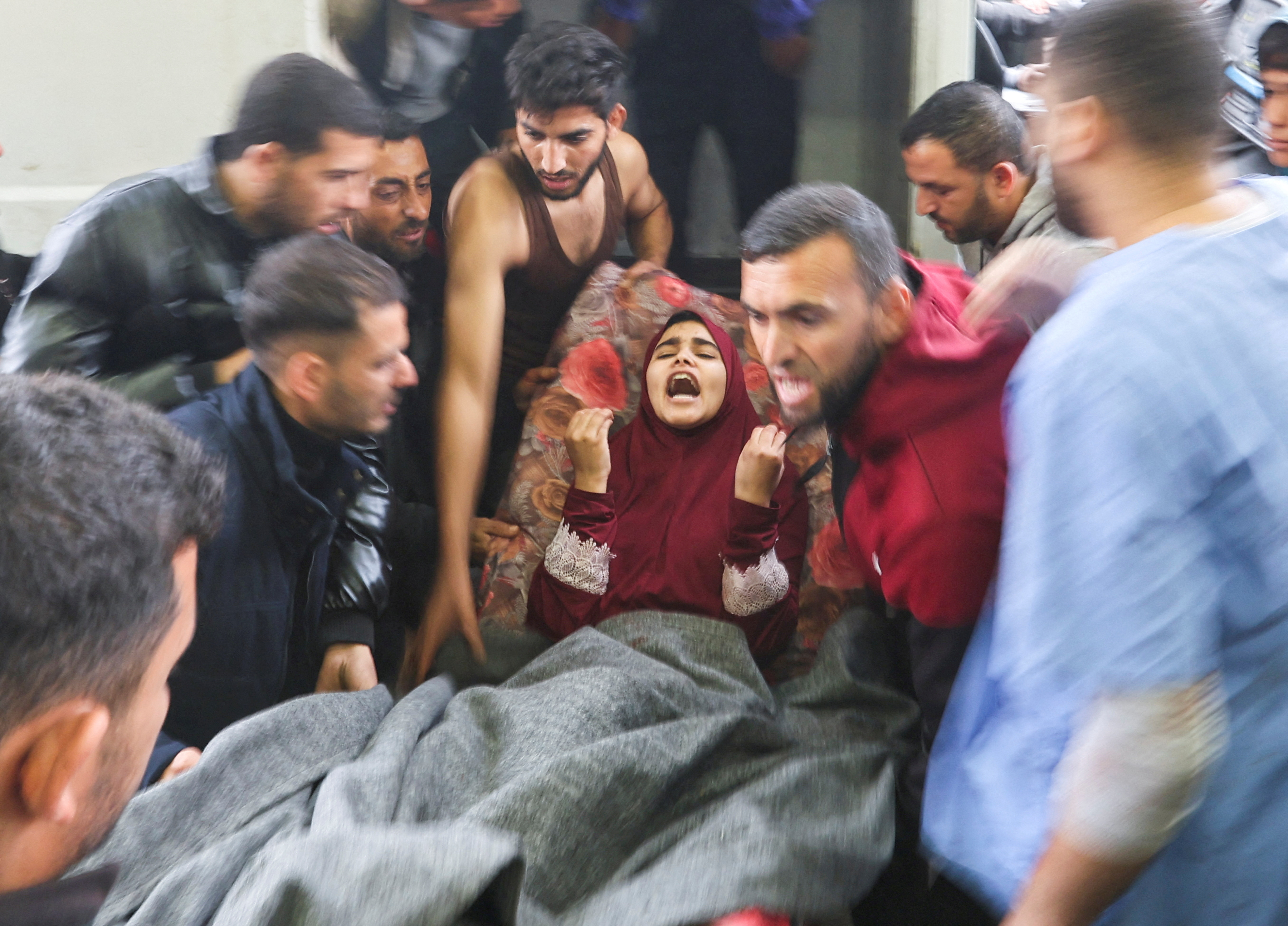 Wounded Palestinians are rushed into Nasser hospital, in Khan Younis