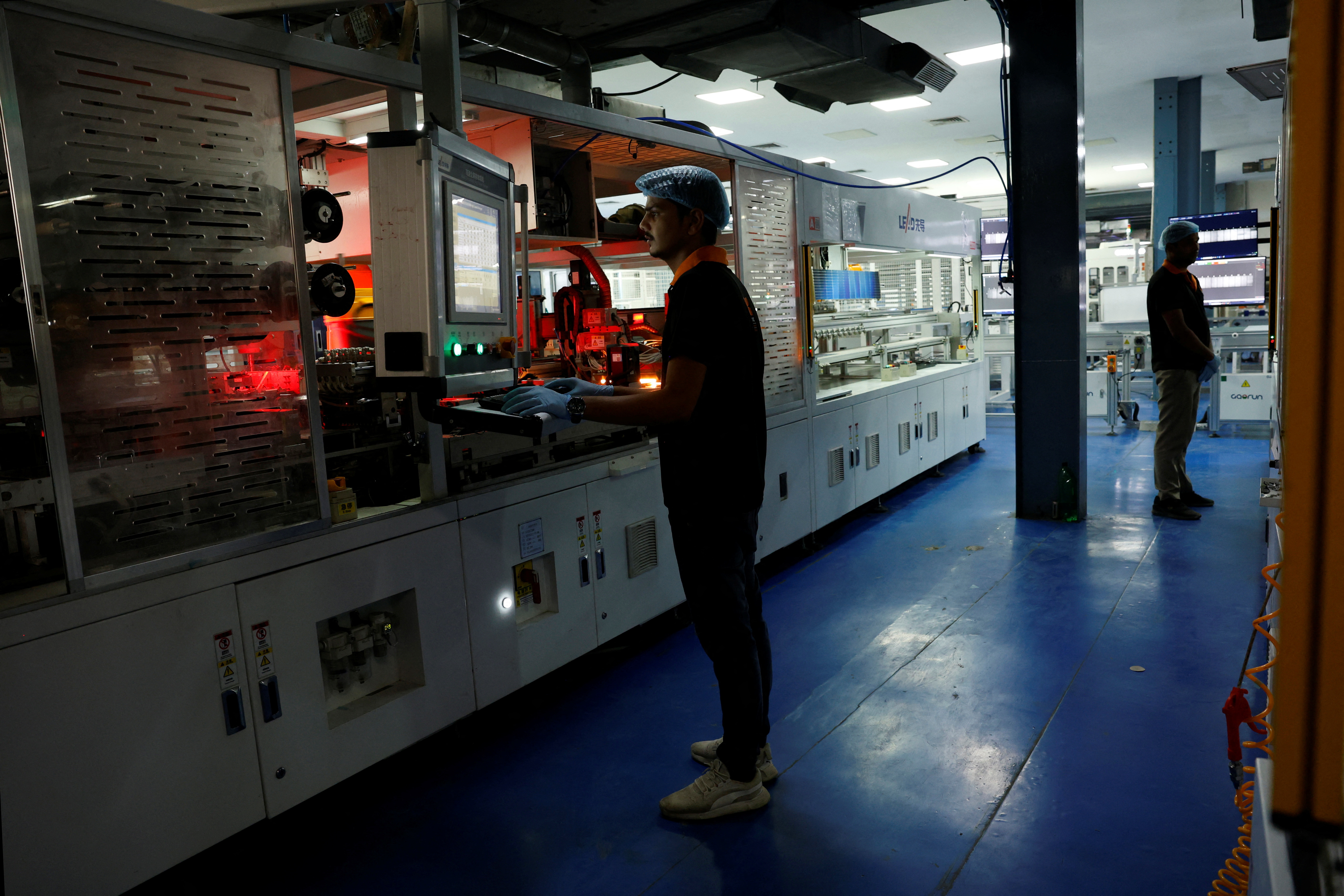 Kapil Sharma, 19, technician, works on the assembly line in a solar panel manufacturing hub, in Greater Noida