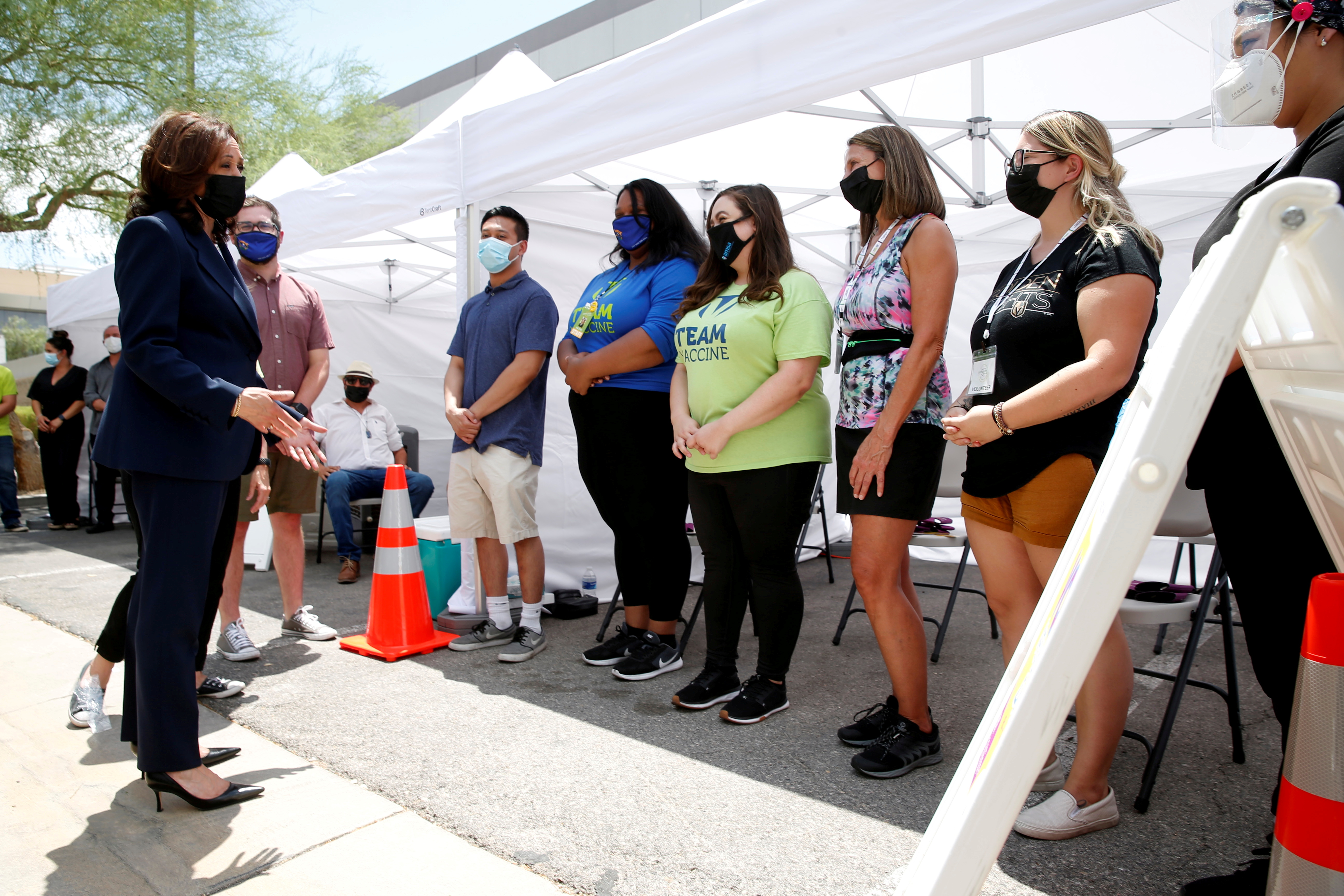U.S. Vice President Kamala Harris (L) speaks with workers at a pop-up COVID-19 vaccine clinic outside the Carpenters International Training Center in Las Vegas, Nevada, U.S., July 3, 2021. REUTERS/Steve Marcus