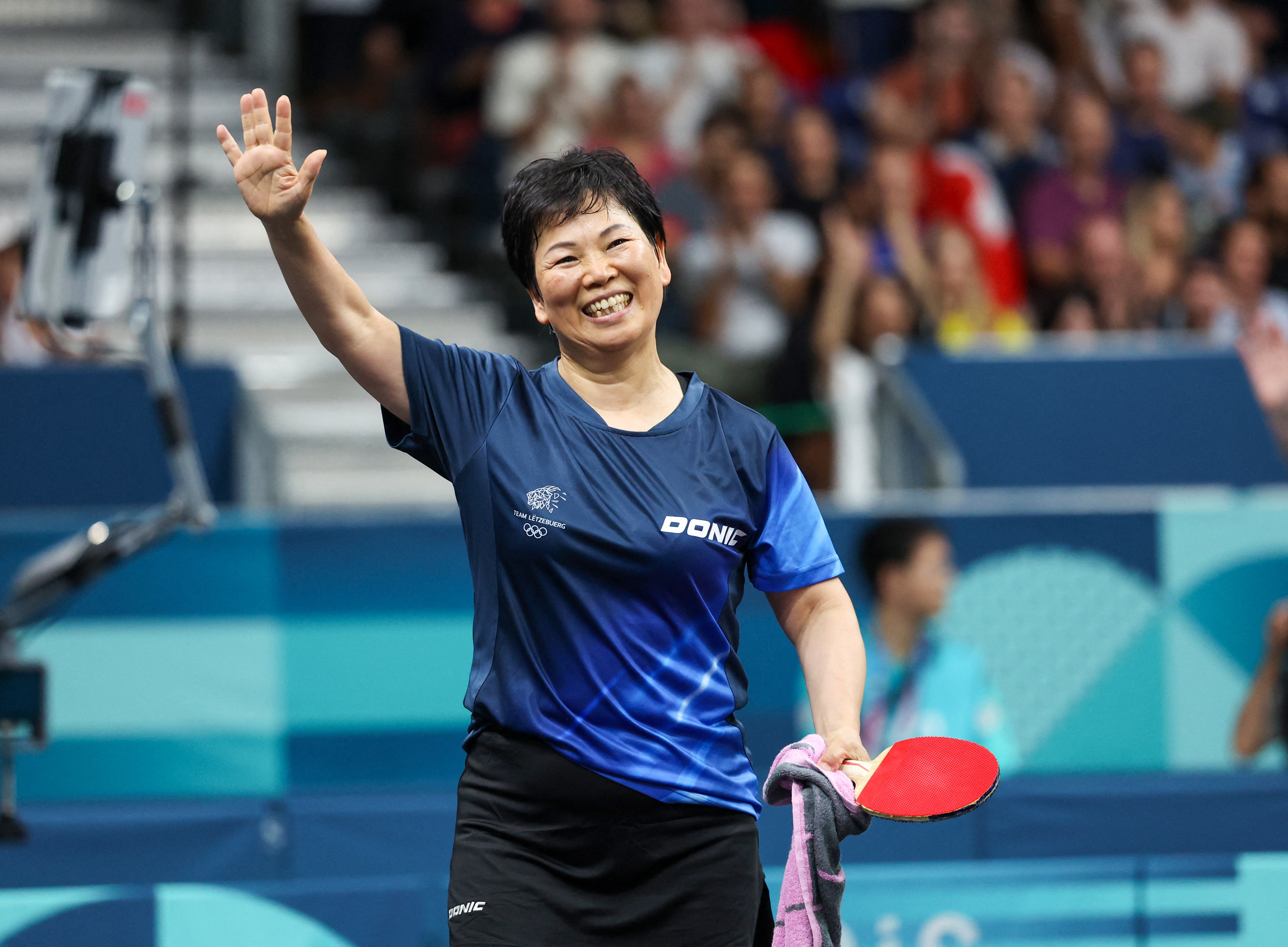 五輪＝61歳シャリャン・ニ、世界1位に完敗 卓球女子6回目出場 | ロイター