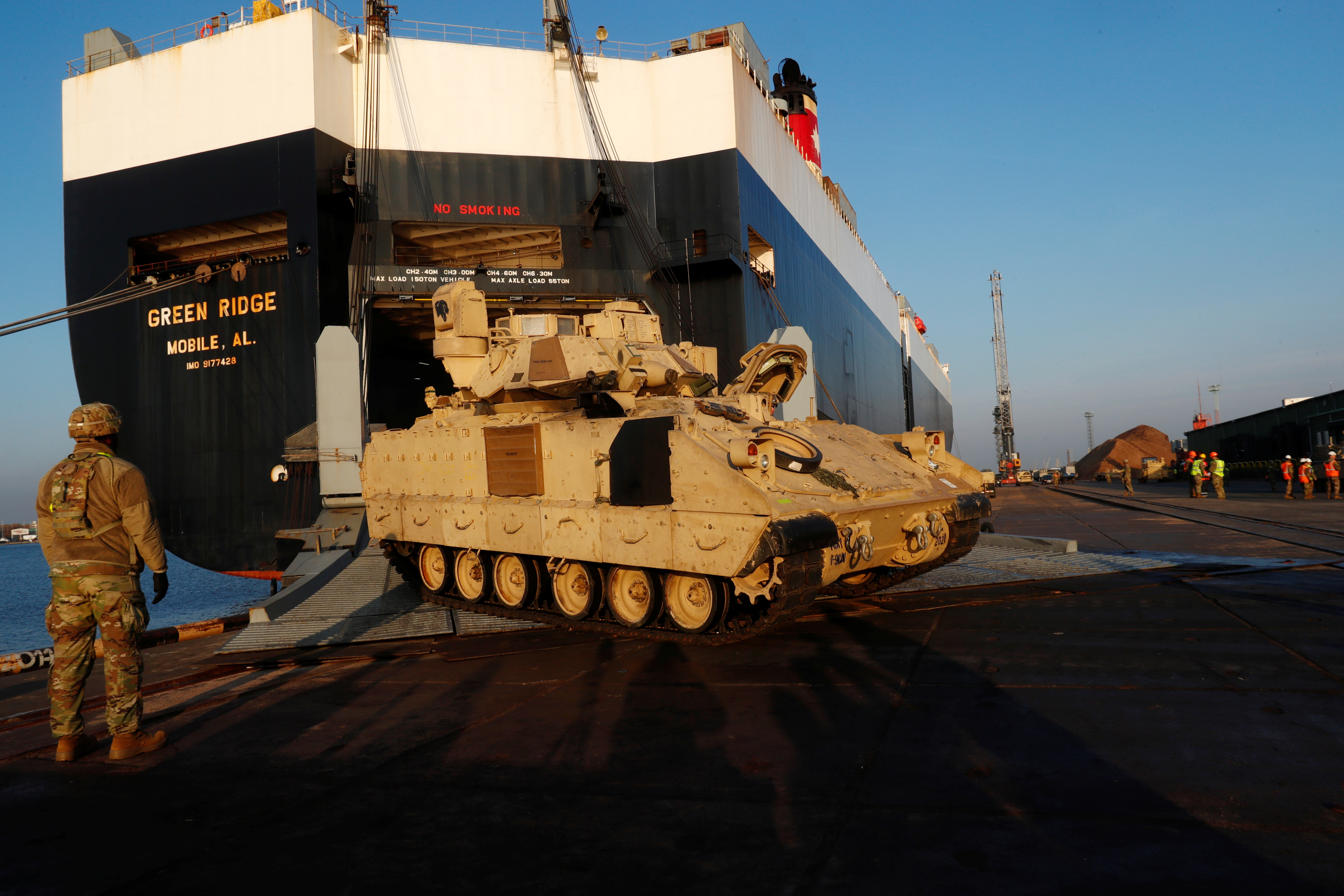 U.S. Army Bradley Cavalry Fighting Vehicle leaves ship during operation Atlantic Resolve rotation in Riga port