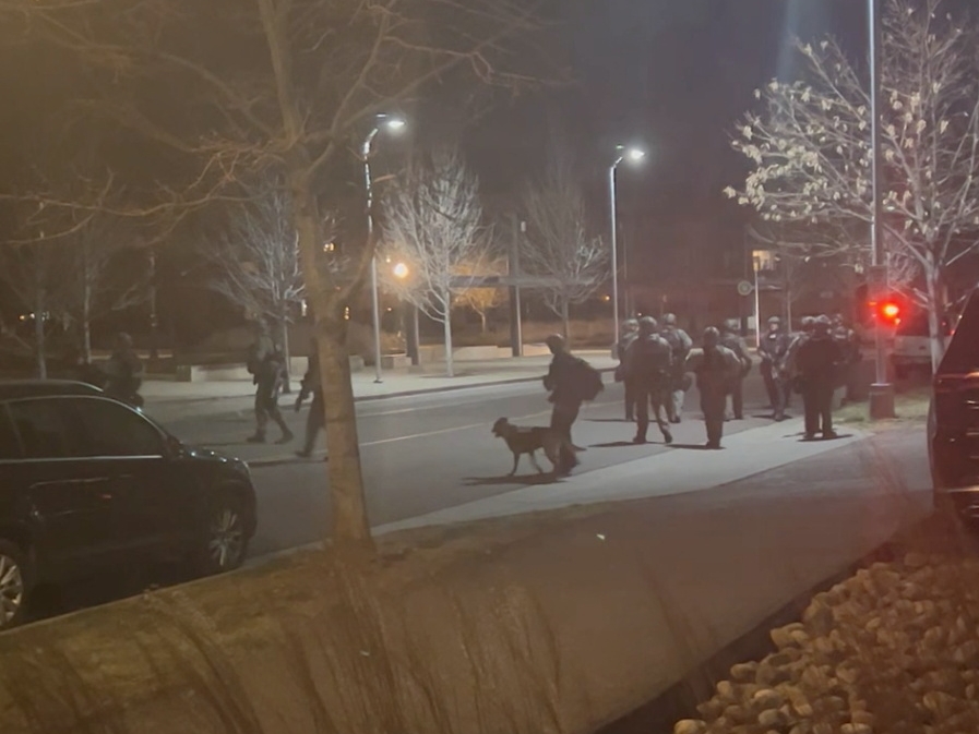 Officers gather in the street, in Lakewood, Colorado, U.S., December 27, 2021 in this still image taken from a social media video. Hawk Hawkins/via REUTERS