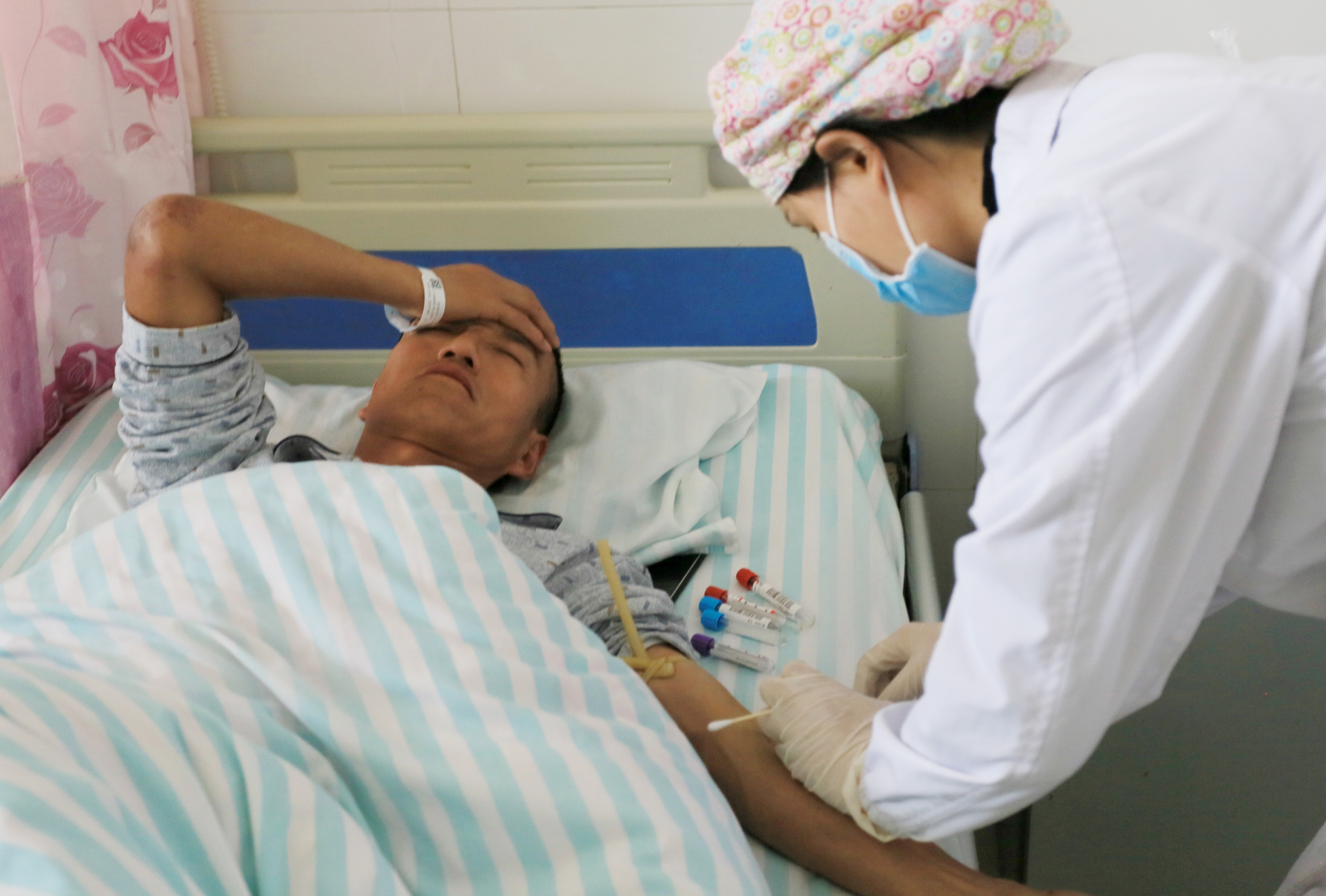 Man receives treatment at a hospital in Jingtai county after extreme cold weather killed participants of an 100-km ultramarathon race in Baiyin
