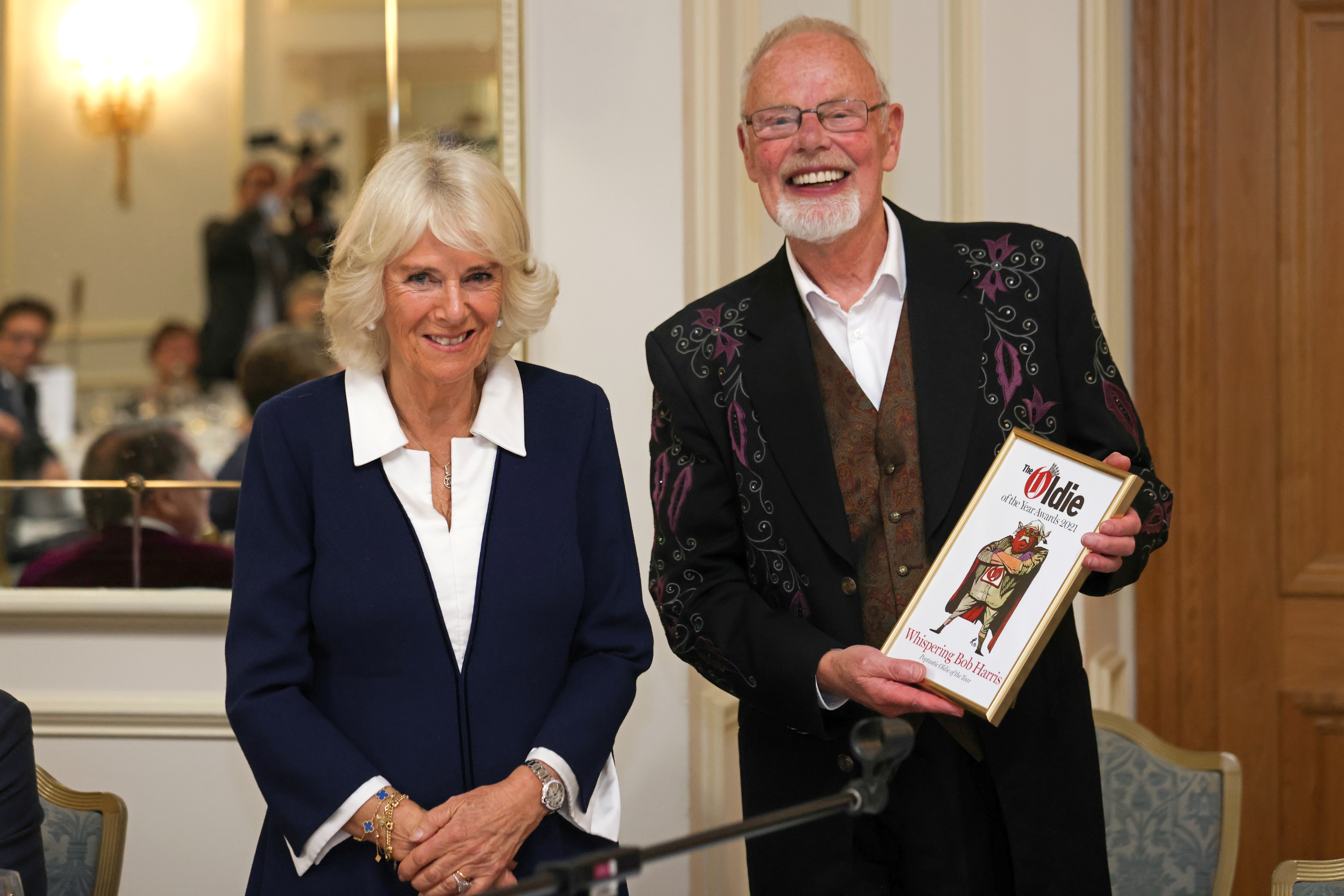 Britain's Camilla, Duchess of Cornwall, presents Whispering Bob Harris with the Poptastic Oldie of the Year award at the Oldie Of The Year Awards 2021 at The Savoy Hotel in London, Britain, October 19, 2021. Chris Jackson/Pool via REUTERS