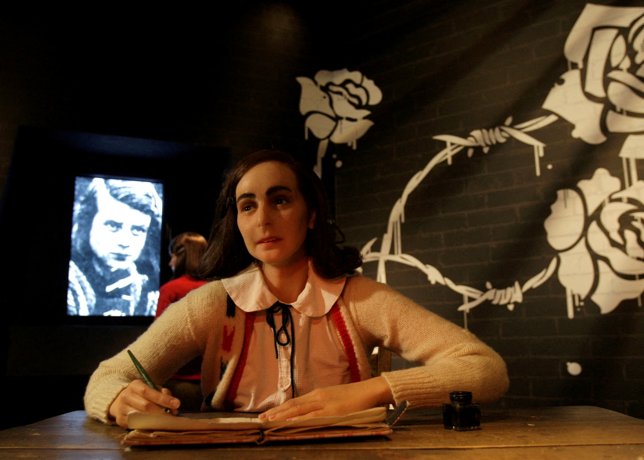 A wax figure of Anne Frank is presented to the public at Madame Tussaud's in Berlin