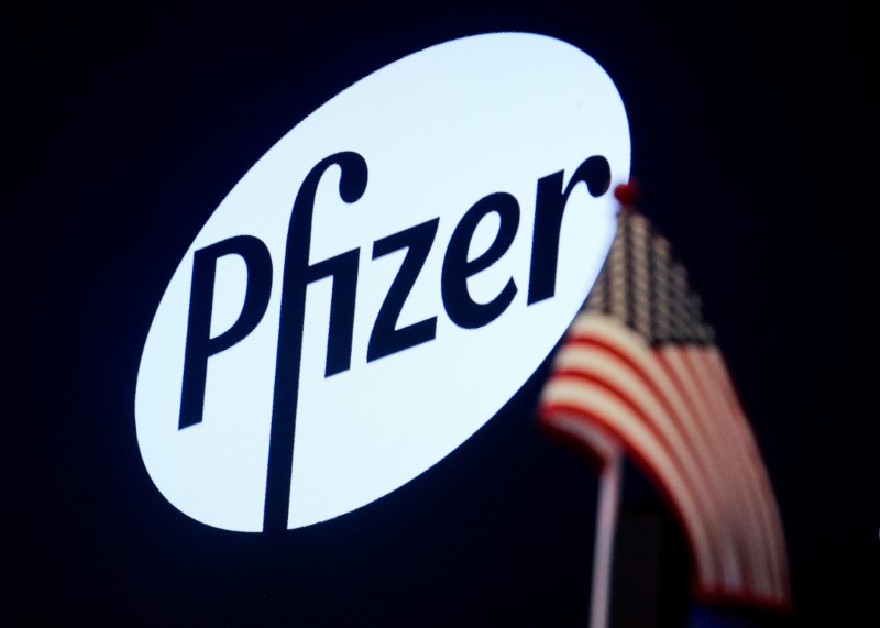 A logo for Pfizer is displayed on a monitor on the floor at the NYSE in New York