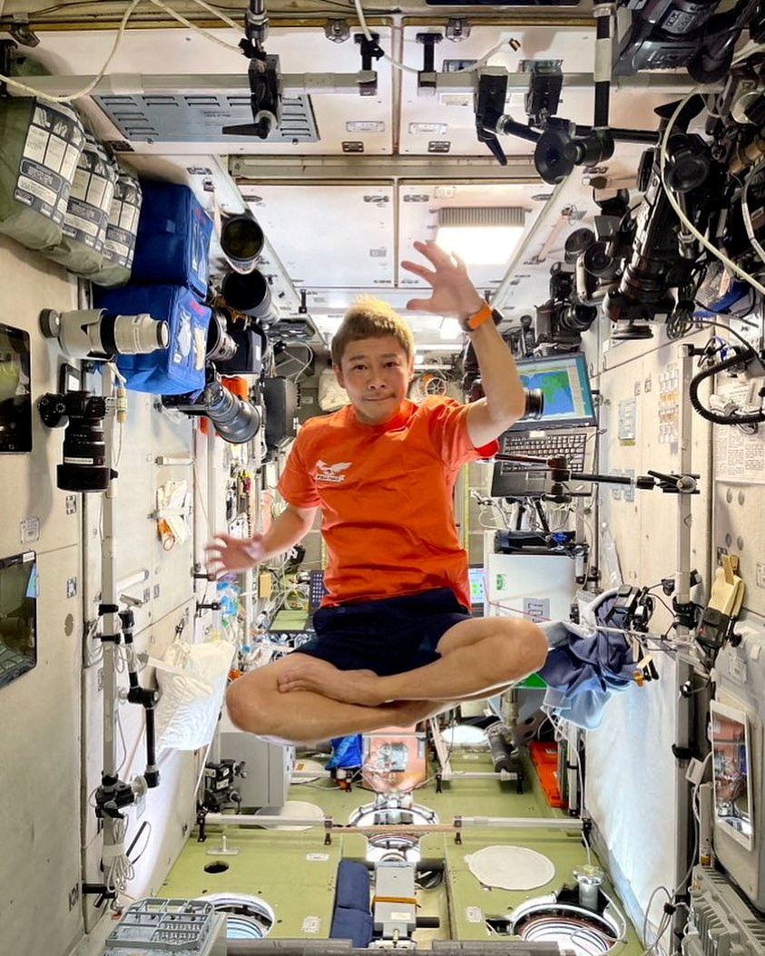 Japanese billionaire Maezawa floats inside the ISS