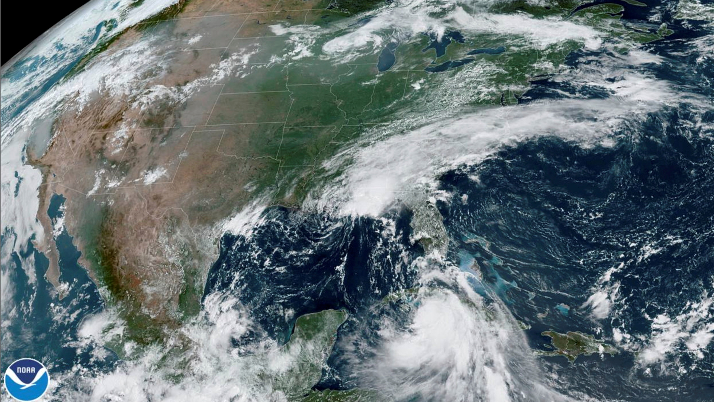 Tropical Storm Marco arrives at the coast of Louisiana as Tropical Storm Laura follows (bottom right) in an image from the National Oceanic and Atmospheric Administration (NOAA) GOES-East satellite August 24, 2020. CIRA/NOAA/Handout via REUTERS. 