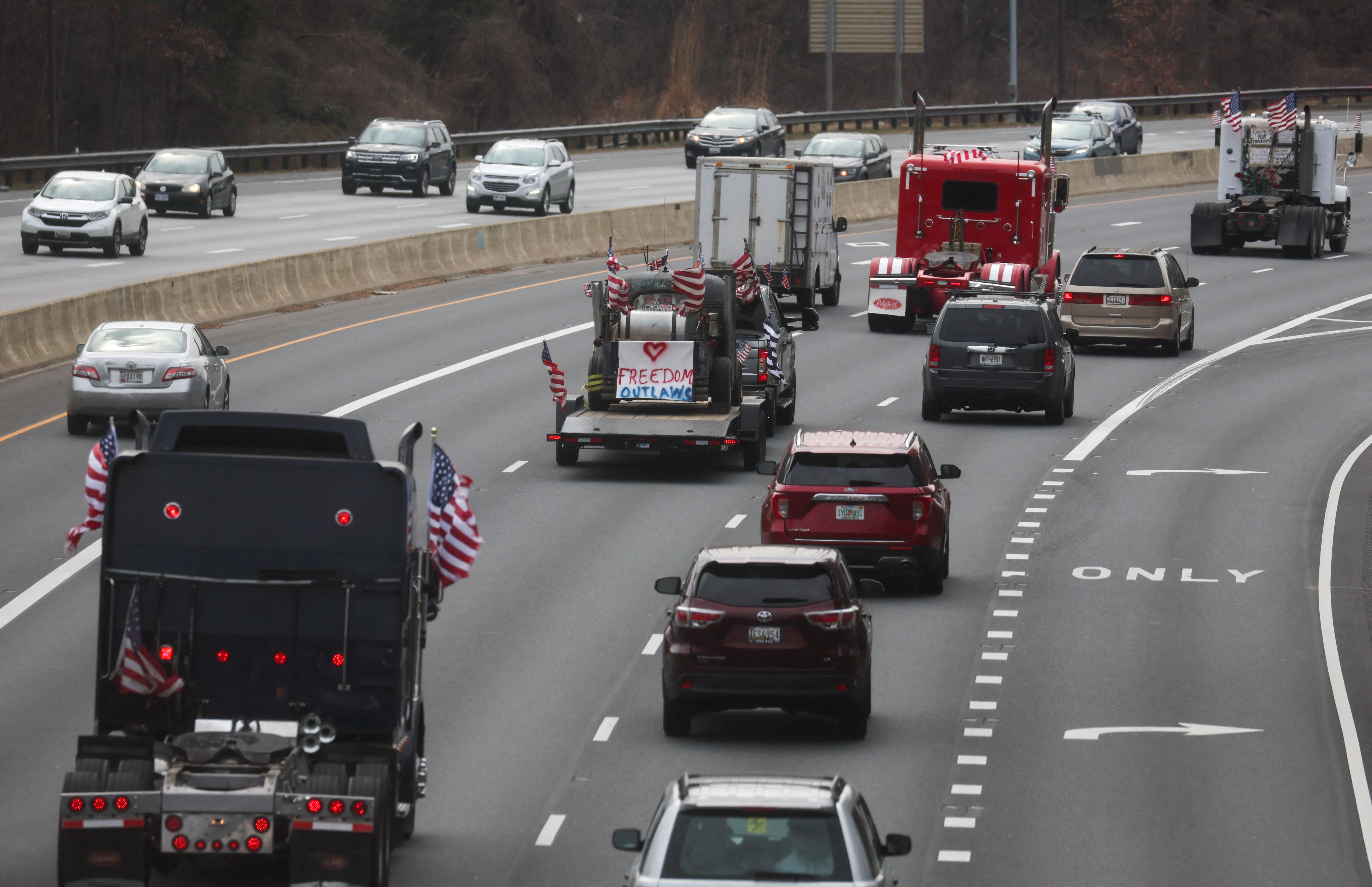 Truckers and their supporters make their way to drive around the Washington beltway