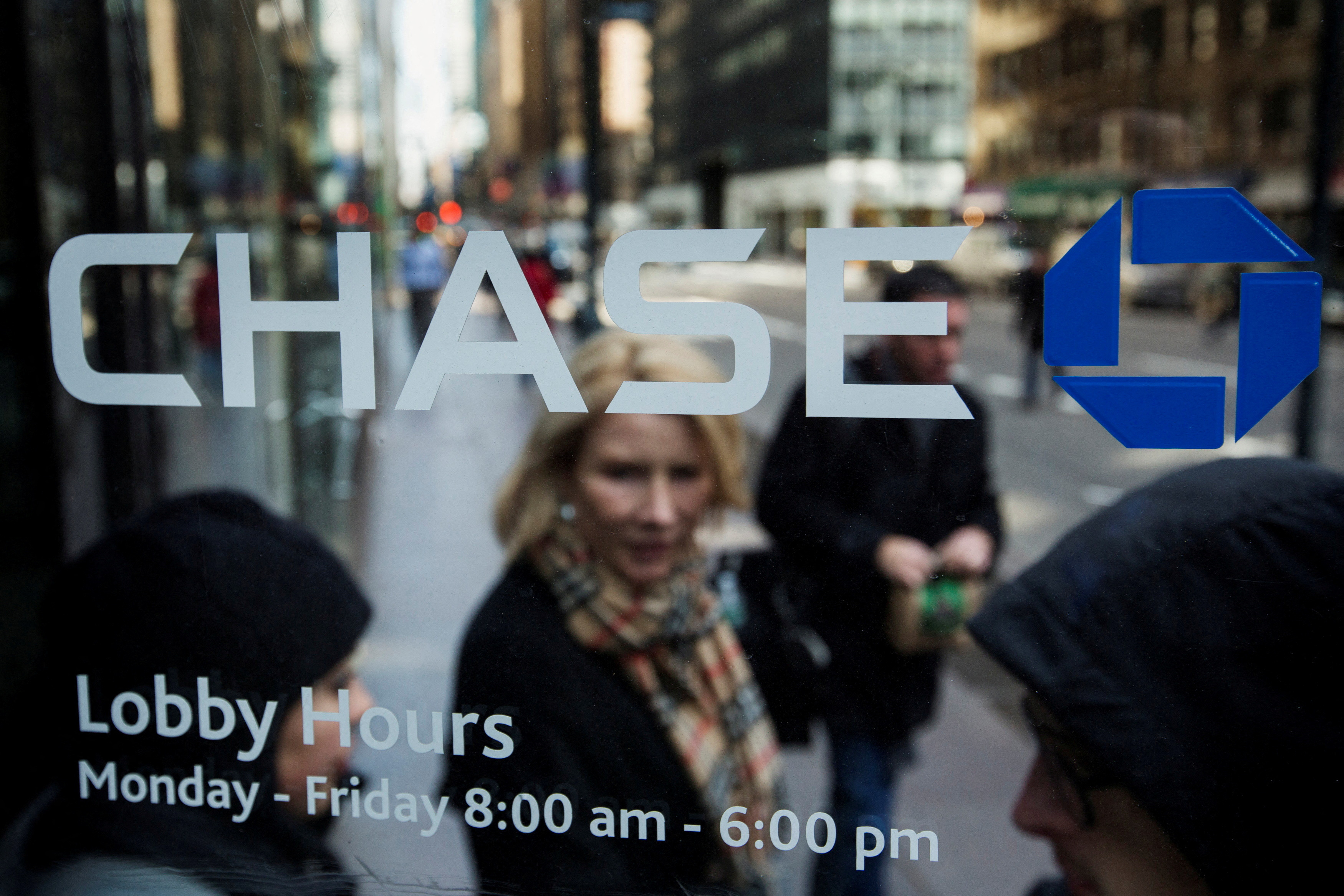 A customer walks out of a branch of the JPMorgan Chase & Co bank in New York