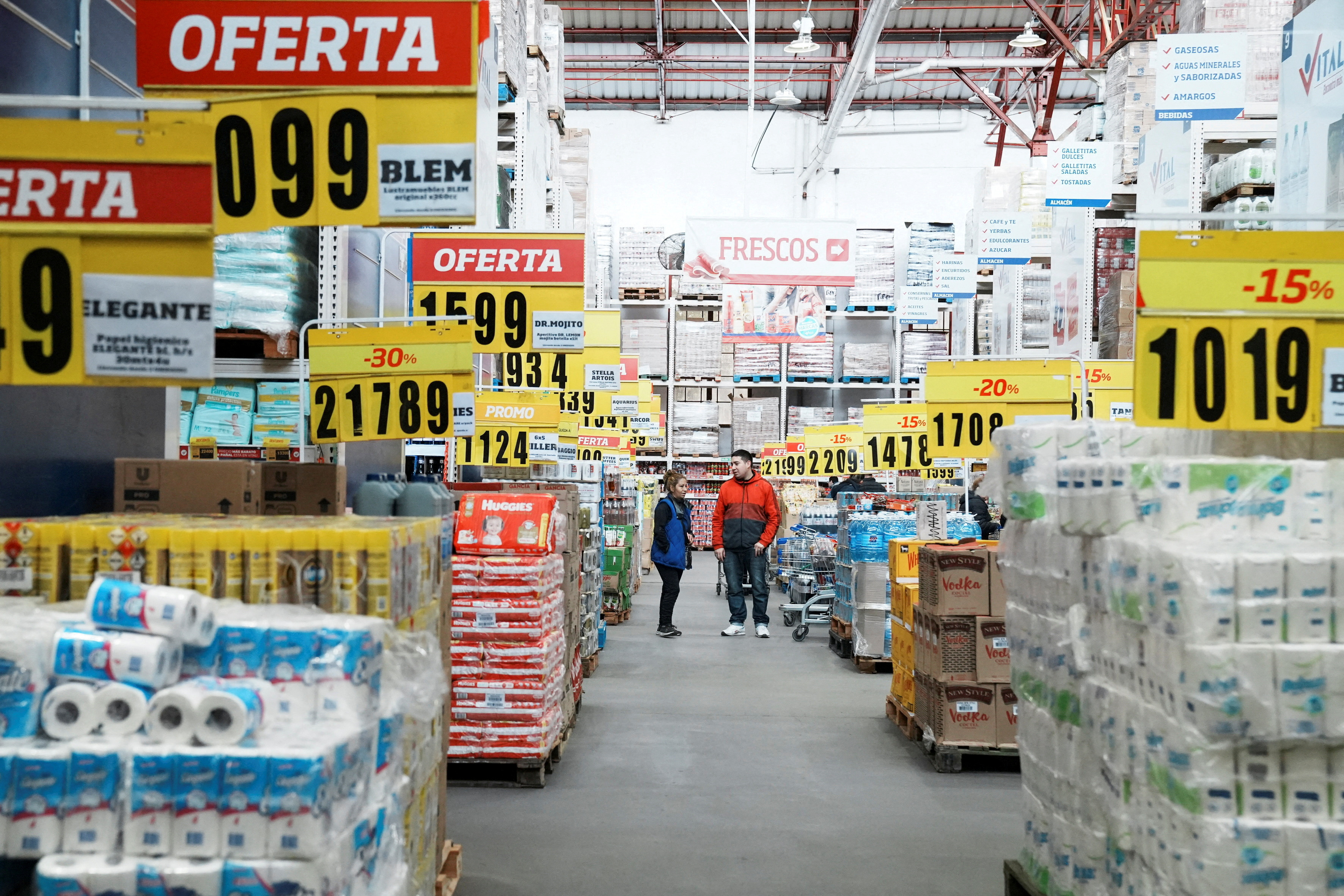Constumers check products at a wholesaler,as Argentina is due to release consumer inflation data for April, in Buenos Aires
