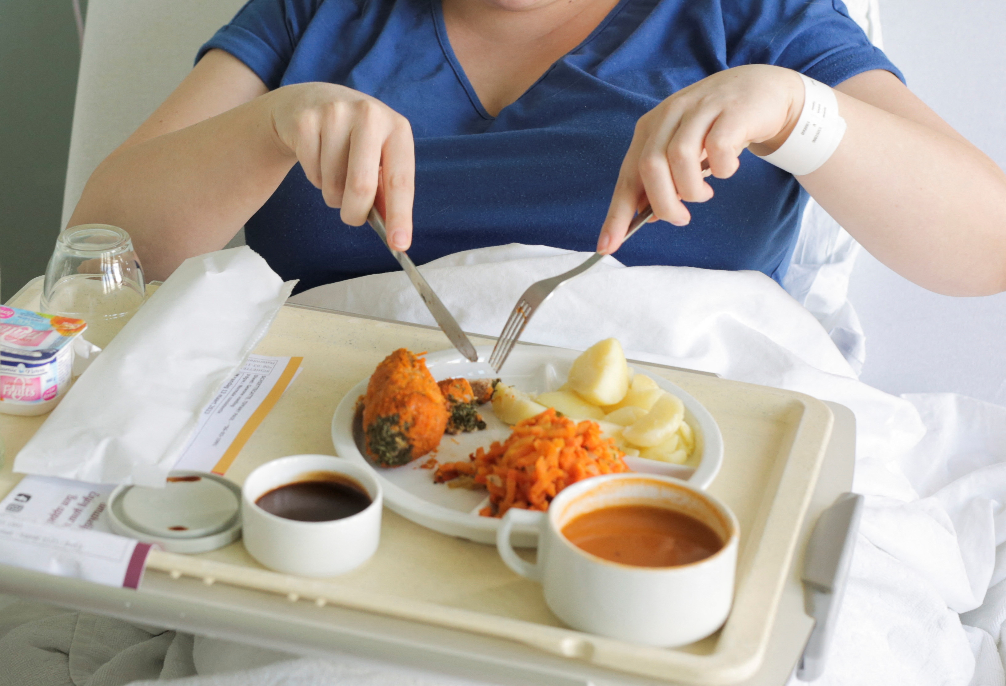 A patient eats her lunch prepared at AZ Groeninge Hospital in Kortrijk