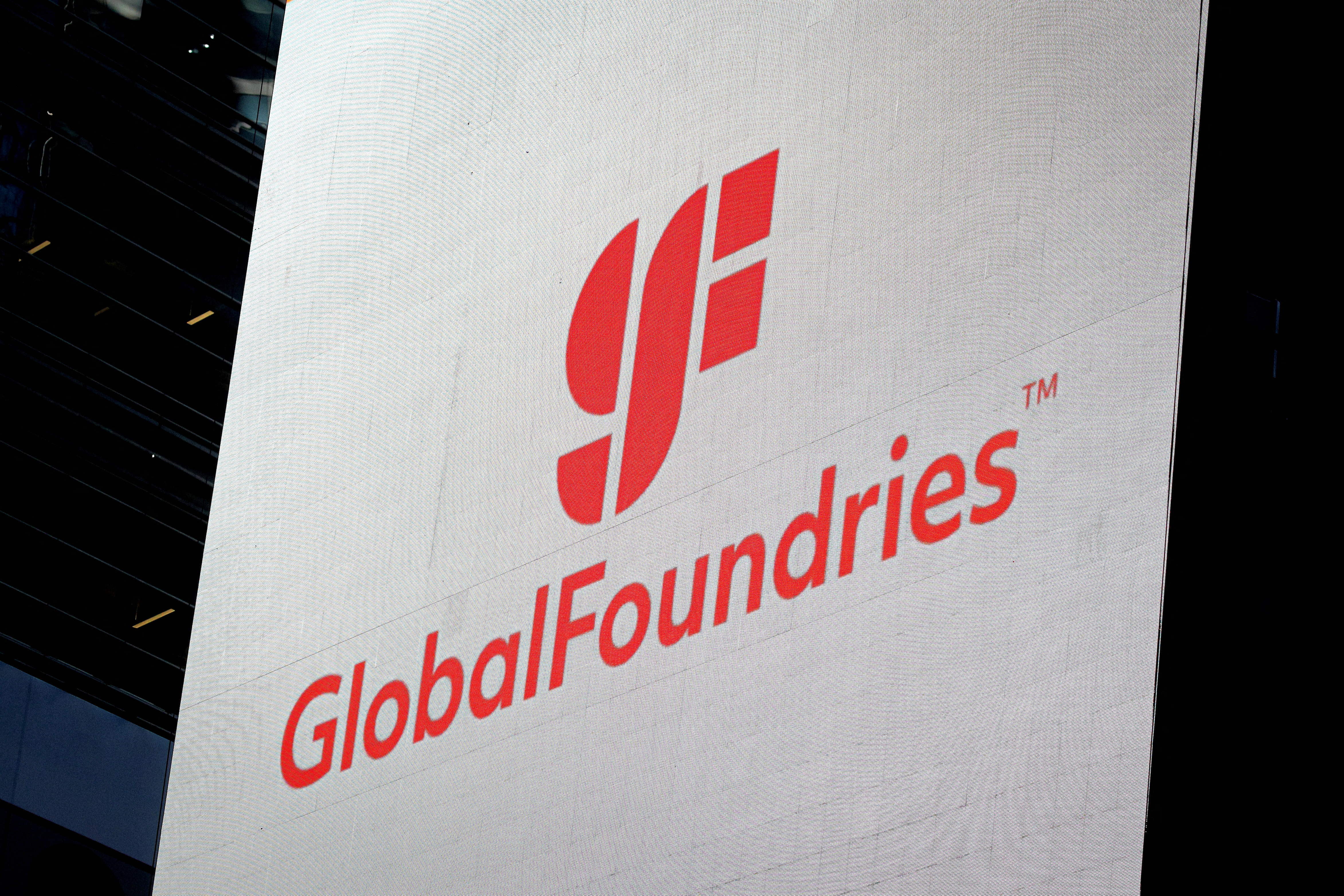 Screen displays the company logo for semiconductor and chipmaker, GlobalFoundries Inc. during the company’s IPO at the Nasdaq MarketSite in Times Square in New York