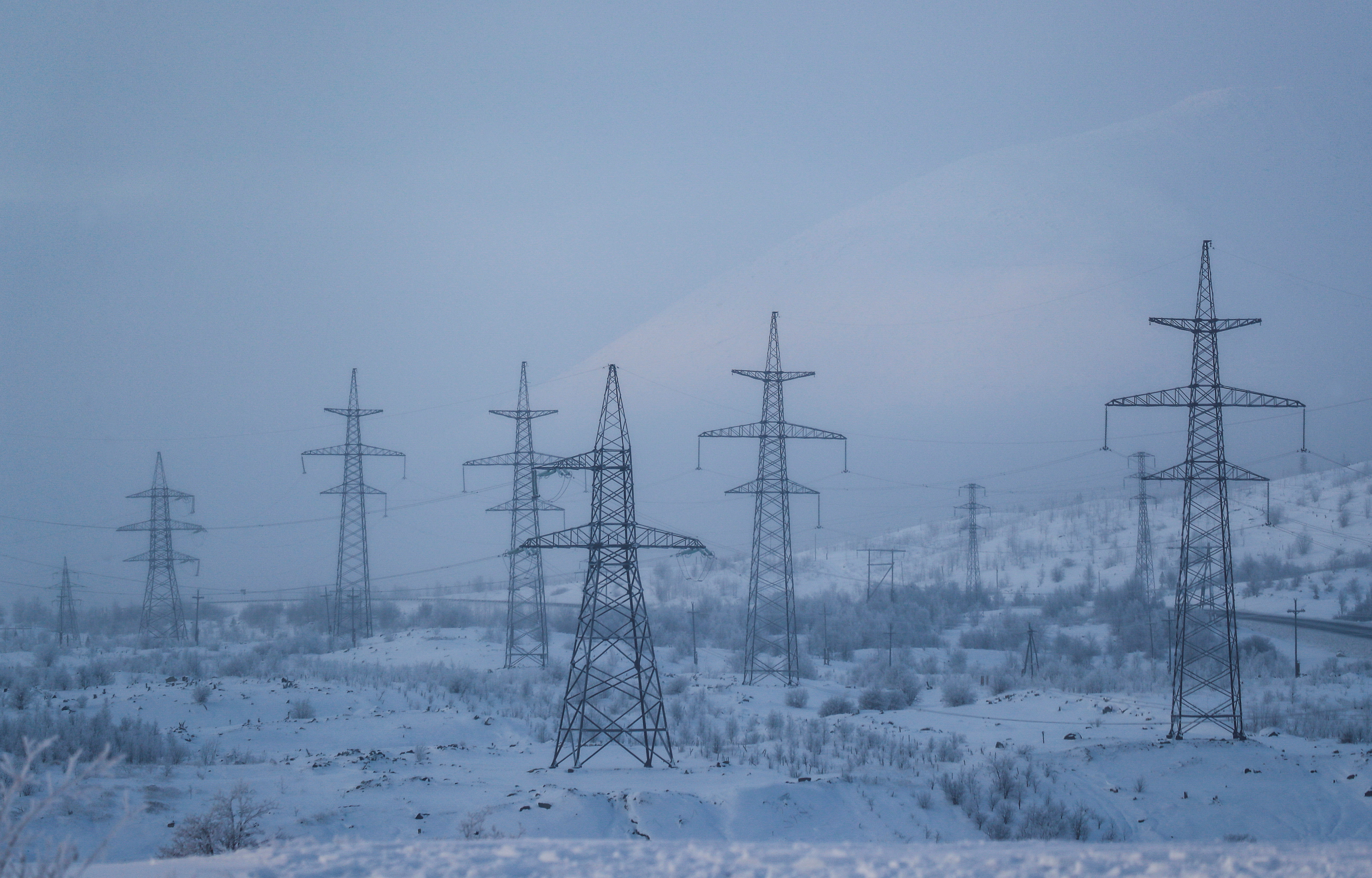 Power transmission lines are seen on a frosty day outside the town of Monchegorsk in Murmansk region