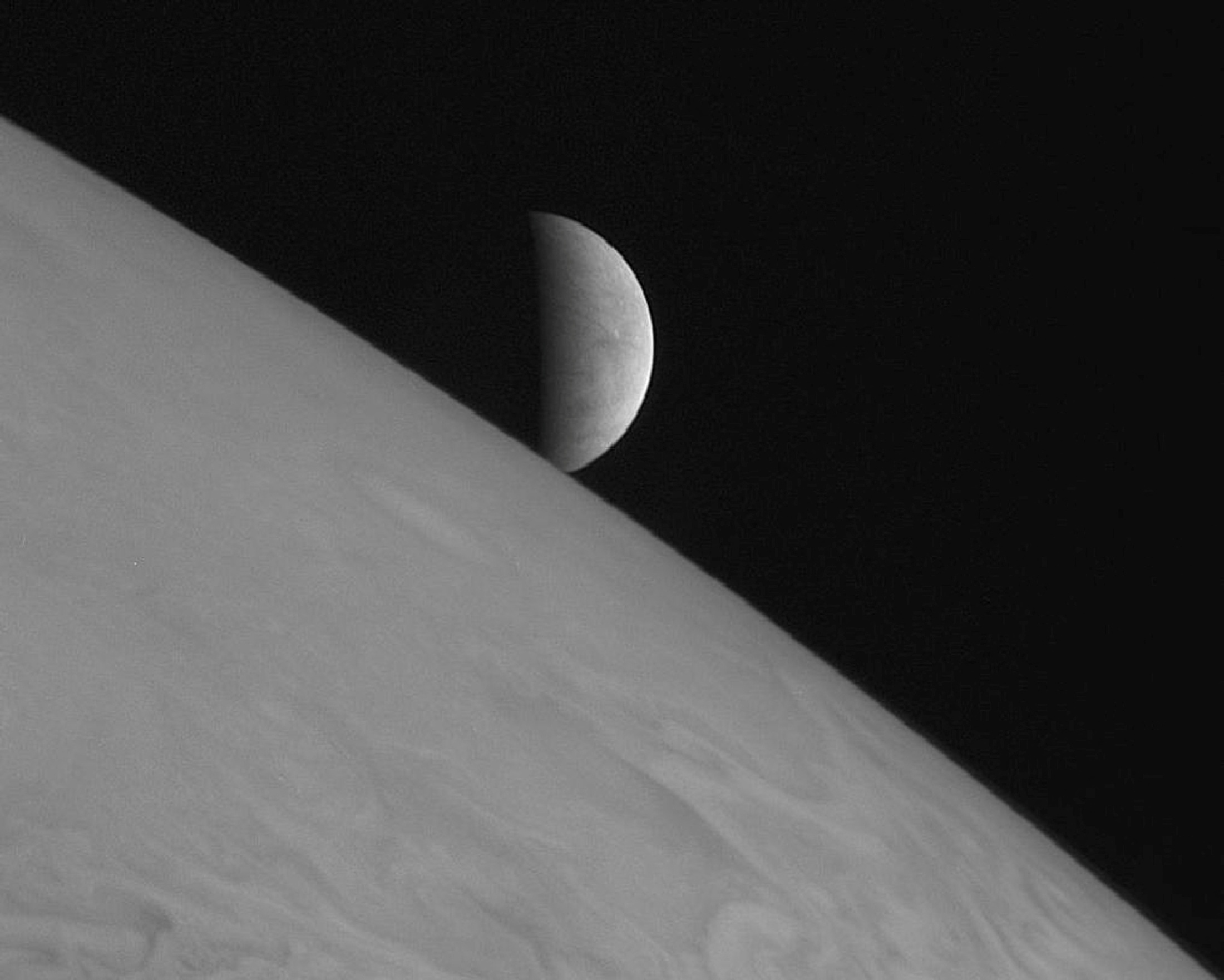 NASA undated handout photo of the moon Europa rising above Jupiter