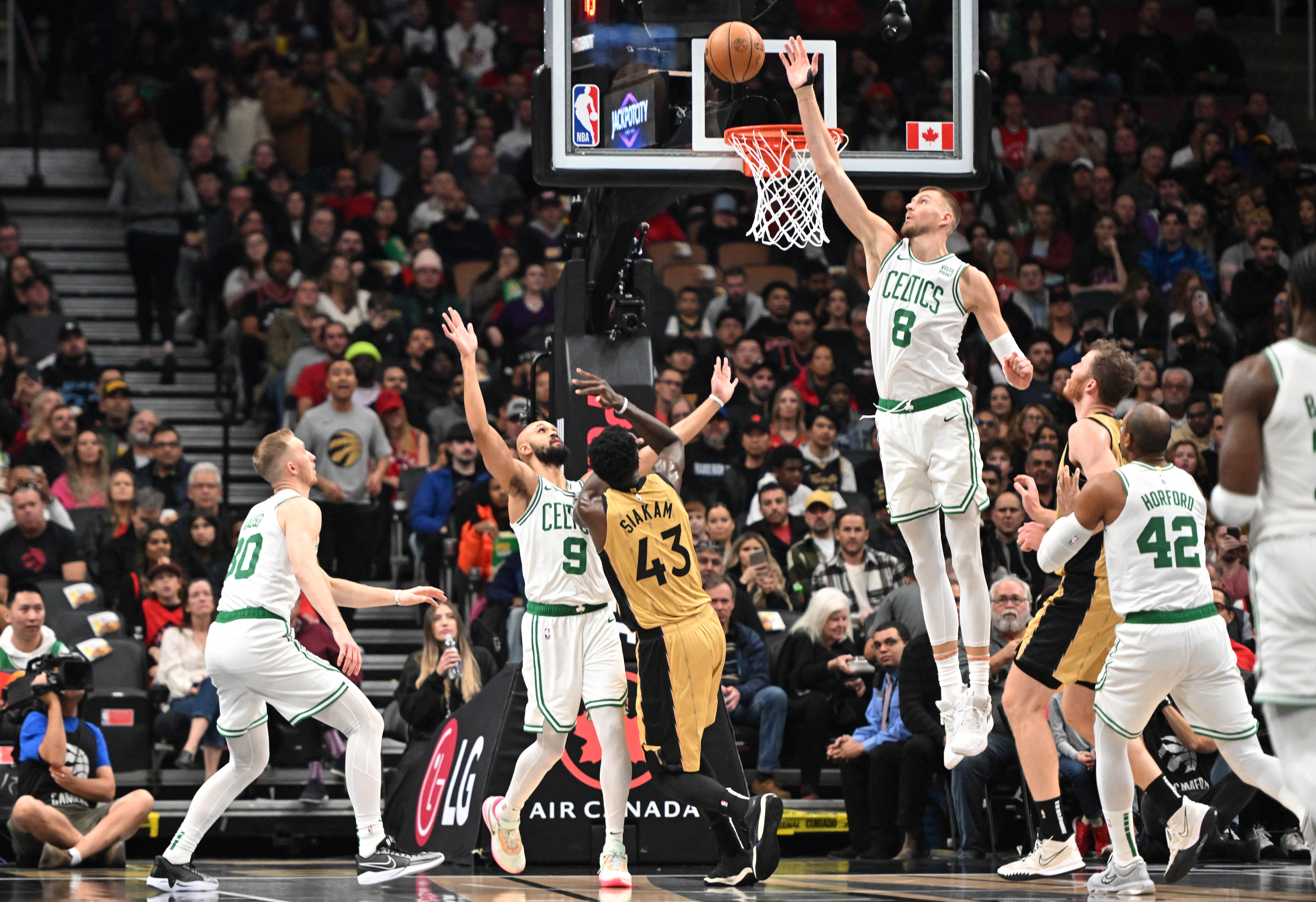 Celtics slip by Raptors for 5th straight win | Reuters