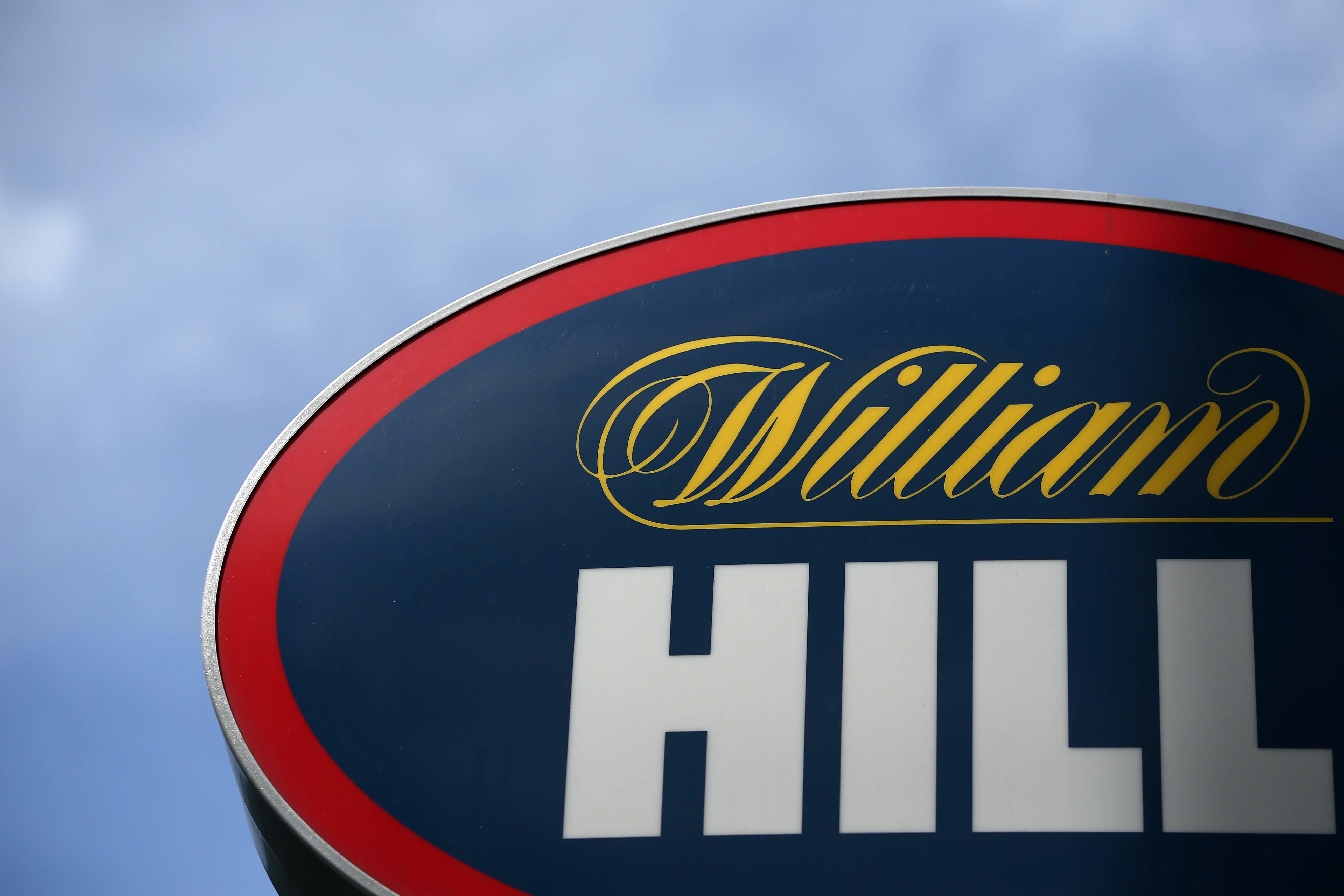 A branded sign is displayed outside a William Hill betting shop in London