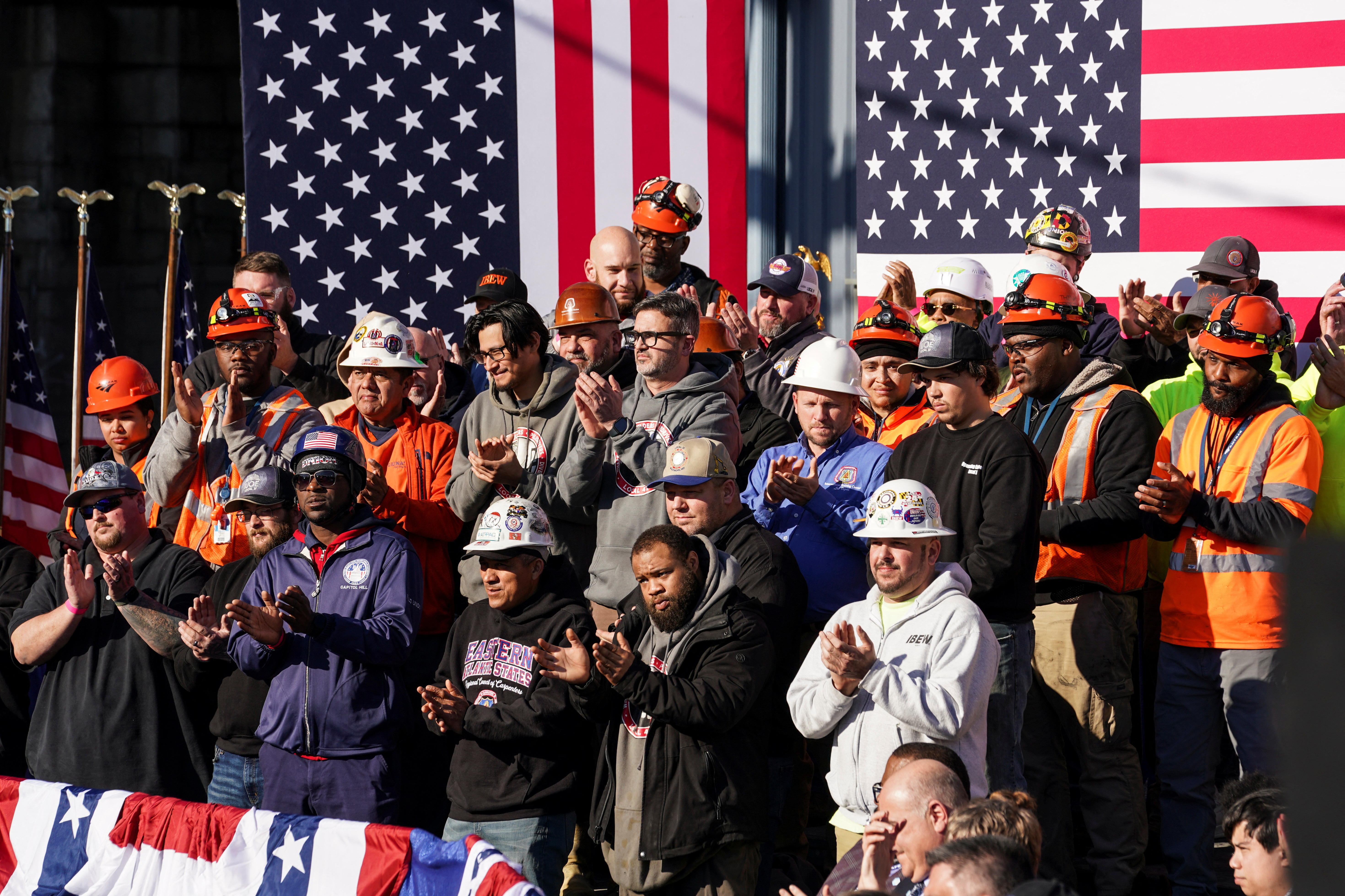 Workers applaud before U.S. President Joe Biden arrived to deliver remarks touting Infrastructure Law spending to replace the Baltimore and Potomac railroad tunnel with the Frederick Douglass Tunnel project, during an event in Baltimore, Maryland, U.S., J