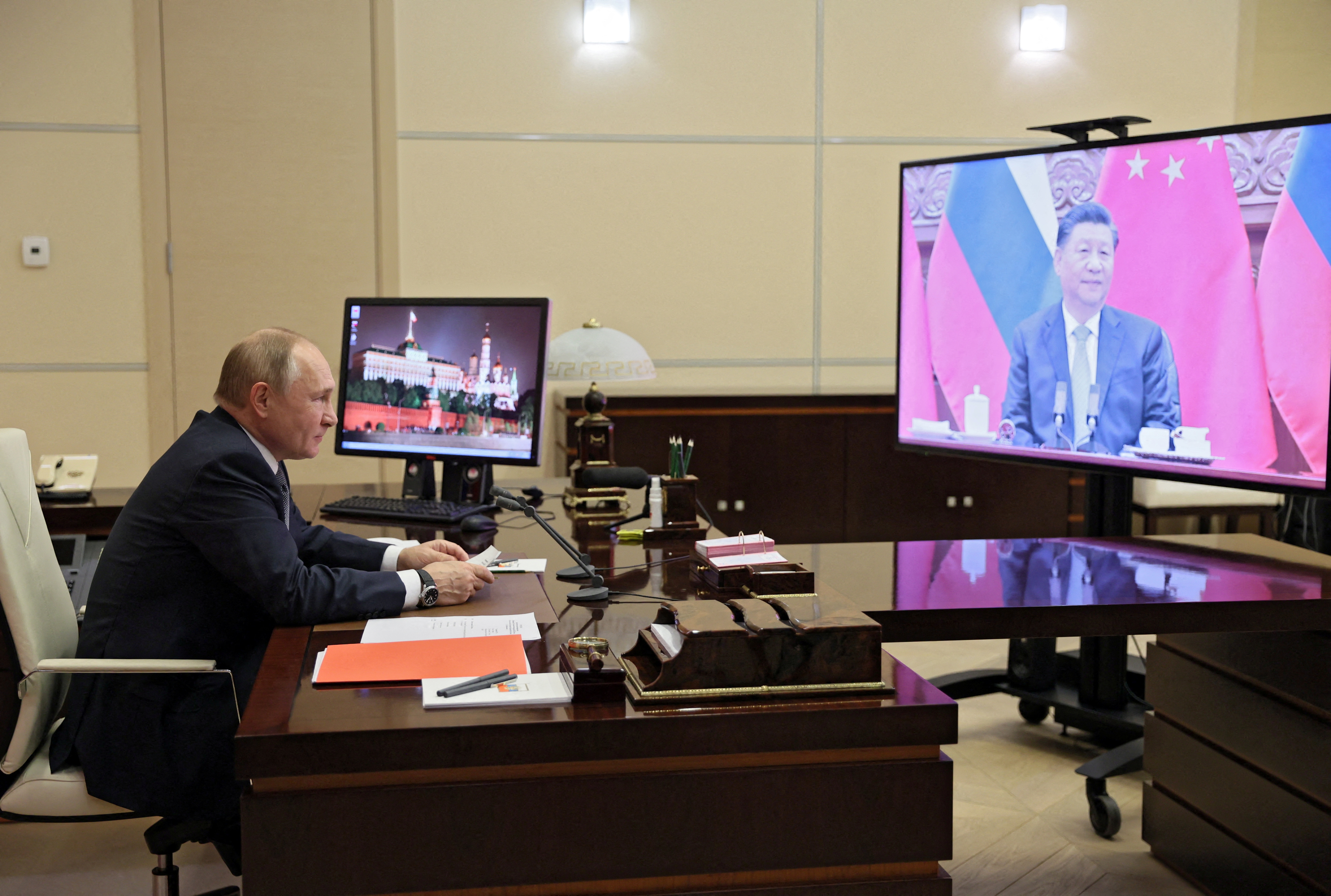 Russian President Vladimir Putin holds talks with Chinese President Xi Jinping via a video link at his residence outside Moscow, Russia December 15, 2021. Sputnik/Mikhail Metzel/Pool via REUTERS 