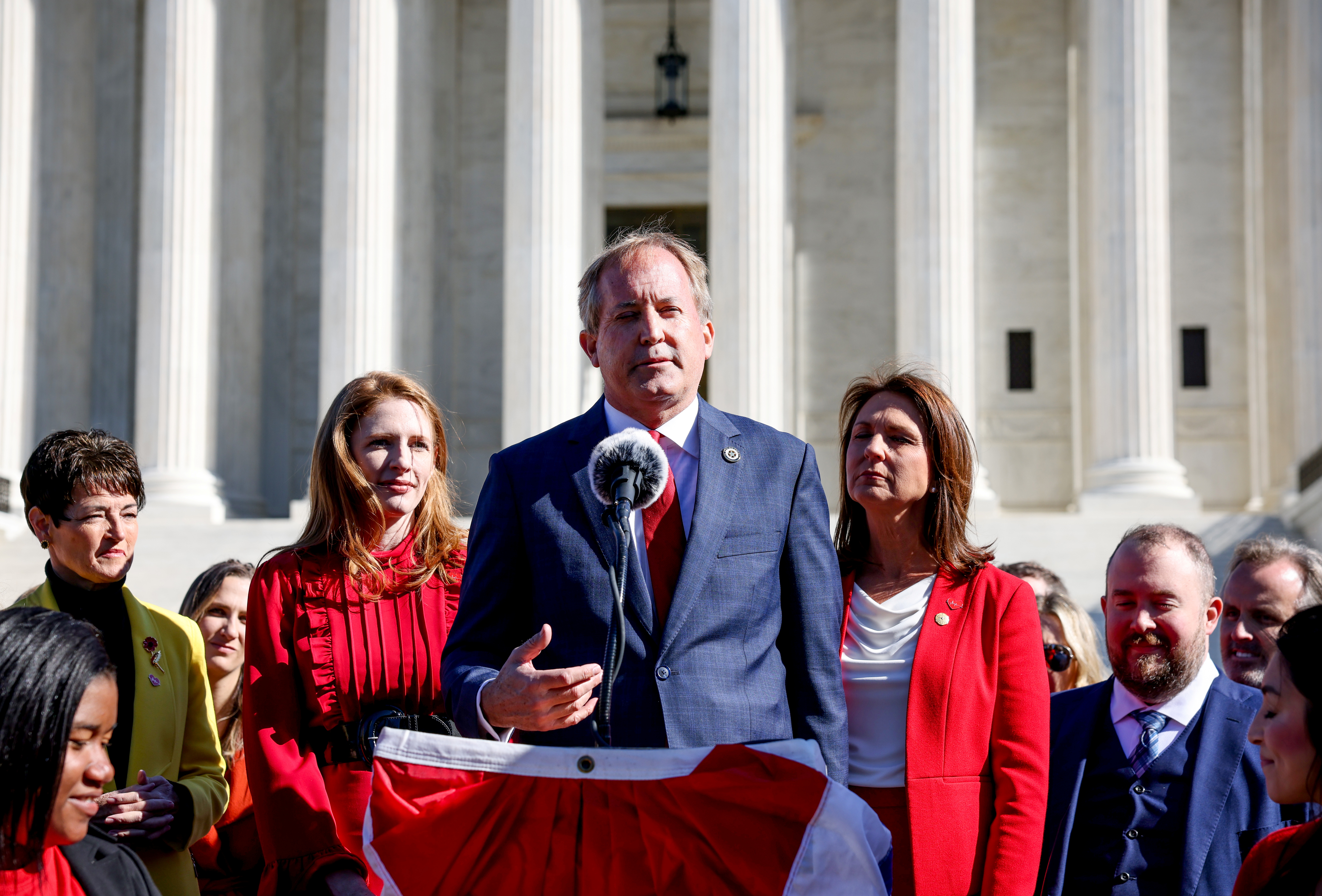 Texas Attorney General Ken Paxton speaks to a crowd of anti-abortion supporters outside the U.S. Supreme Court following arguments over a challenge to a Texas law that bans abortion after six weeks in Washington, U.S., November 1, 2021. REUTERS/Evelyn Hockstein