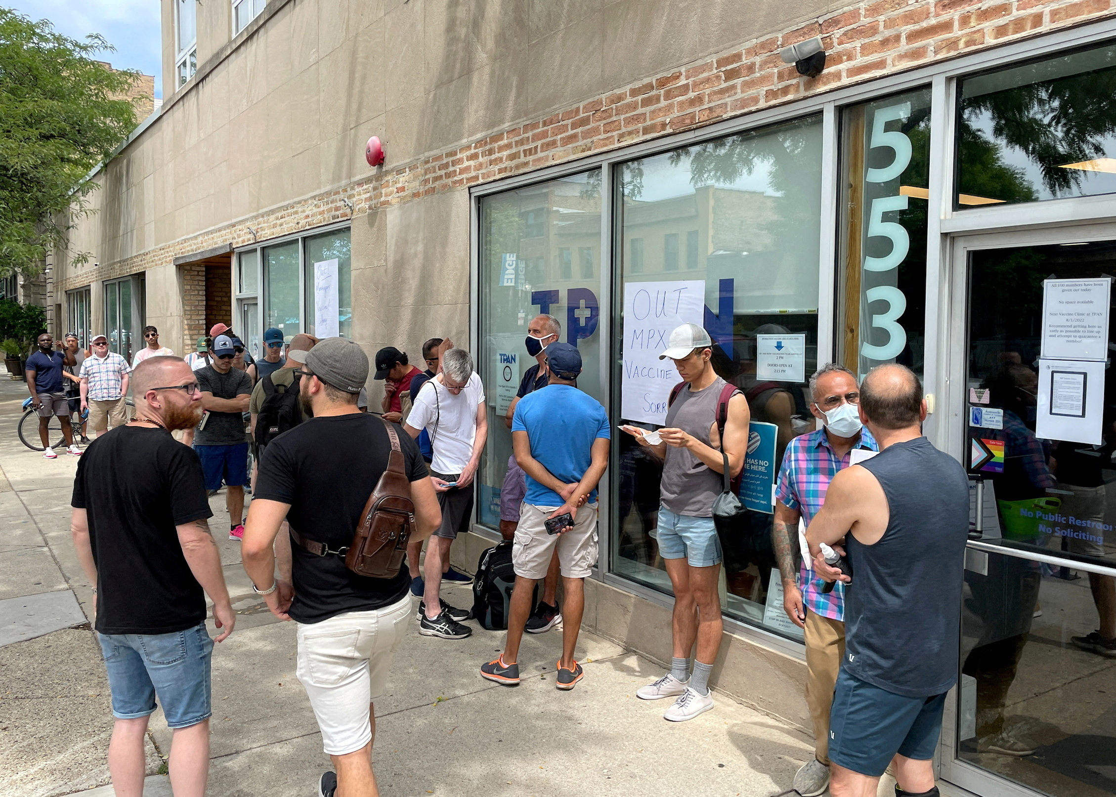 People line up outside the Test Positive Aware Network nonprofit clinic to receive the monkeypox vaccine in Chicago, Illinois