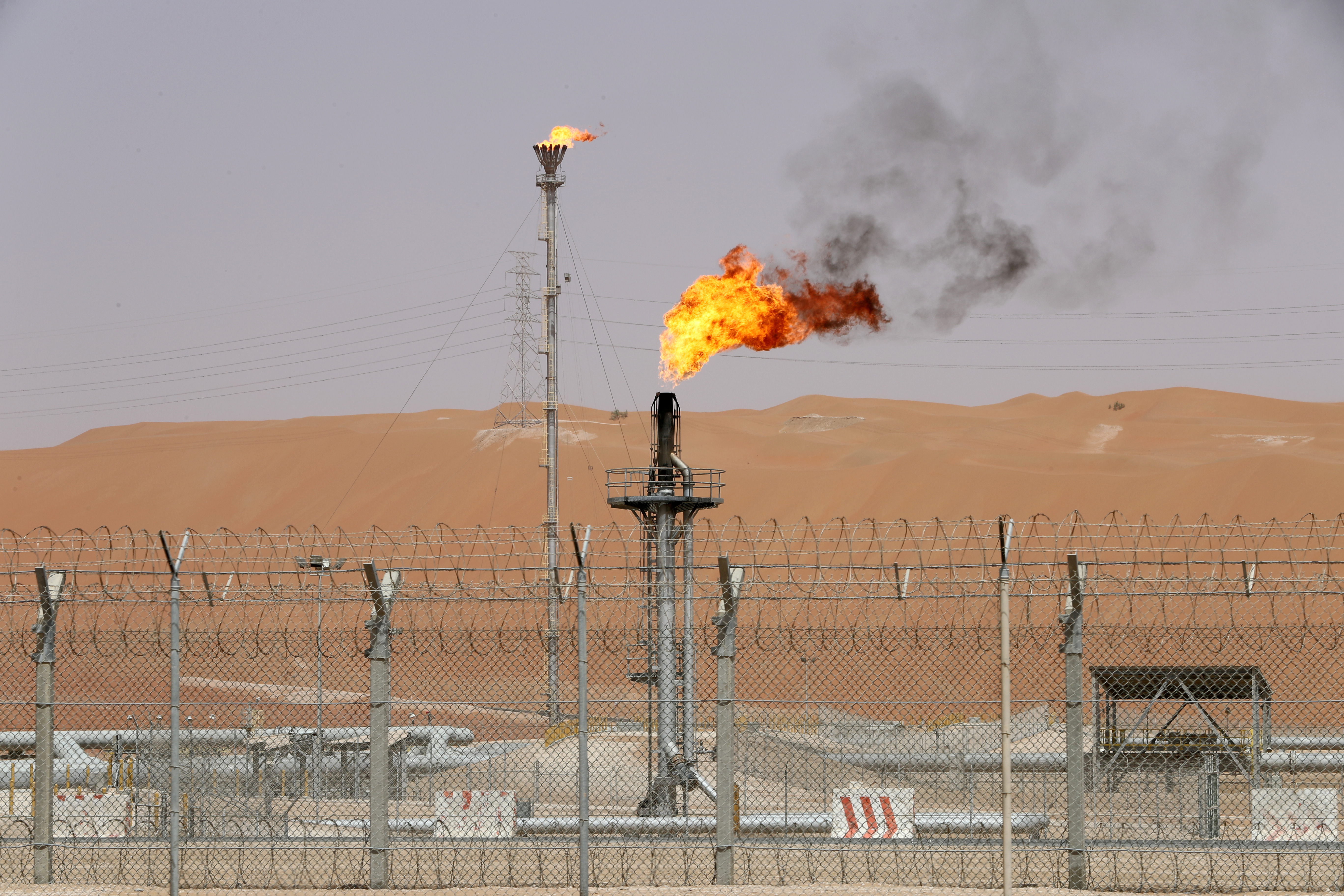 Flames are seen at the production facility of Saudi Aramco's Shaybah oilfield in the Empty Quarter