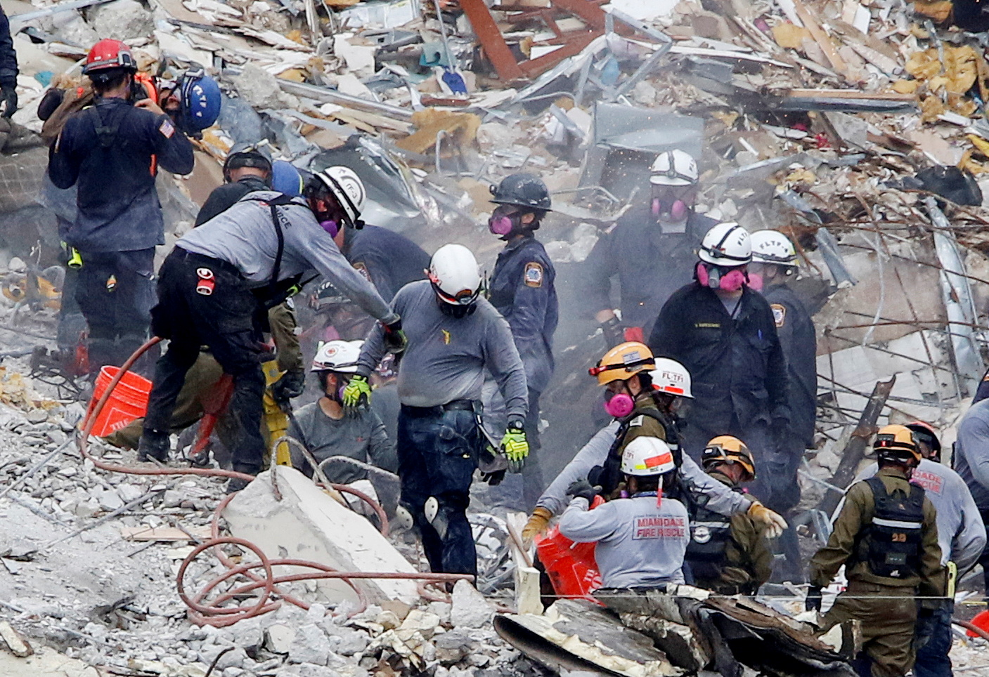 Emergency workers conduct search and rescue efforts at the site of a partially collapsed residential building in Surfside, near Miami Beach, Florida, U.S. June 29, 2021. REUTERS/Joe Skipper