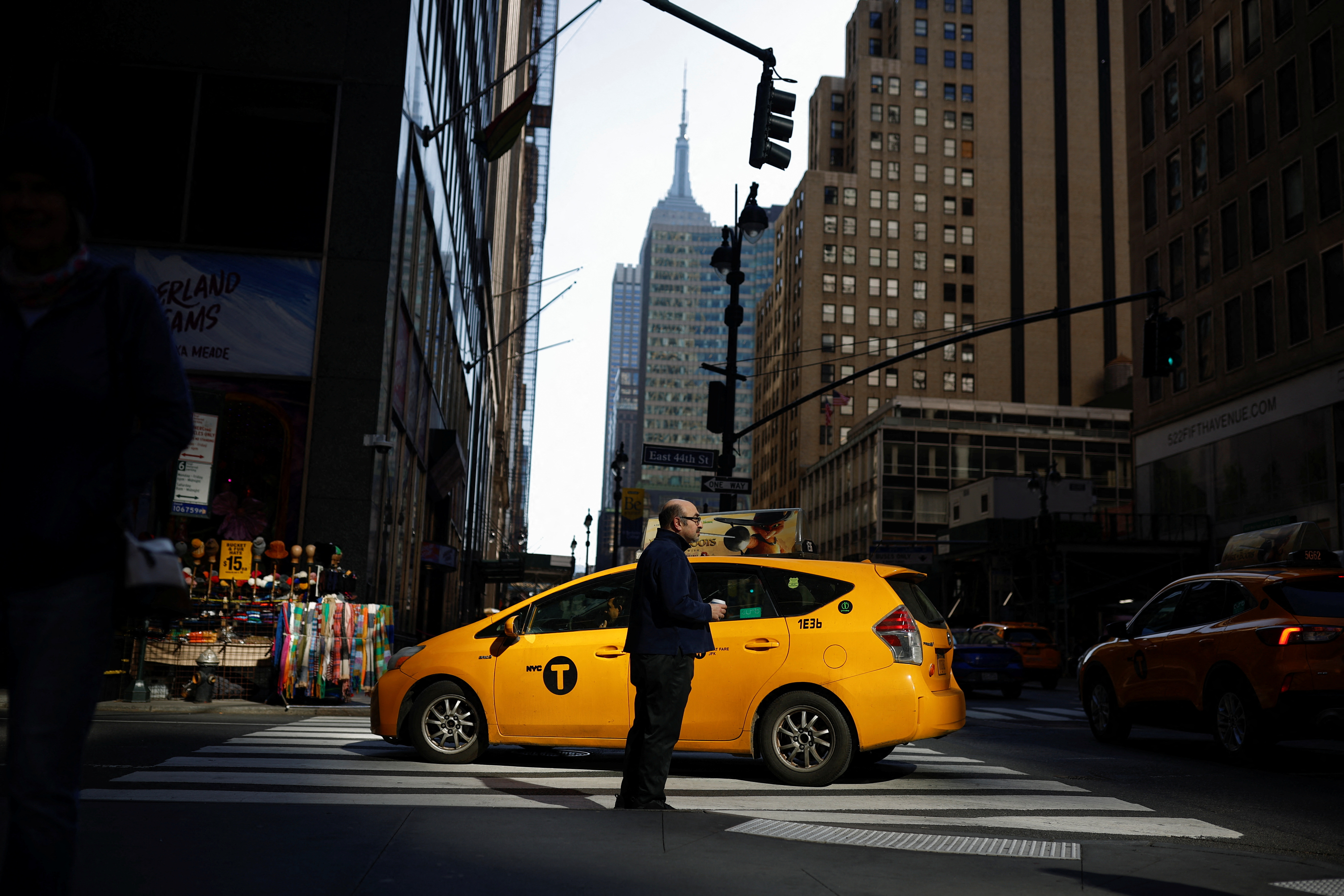 A man stands on the street in Manhattan, in New York City