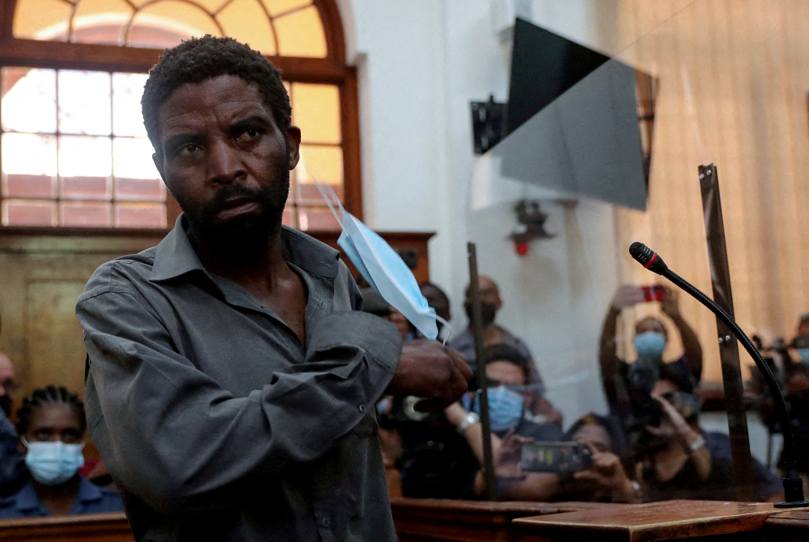 Zandile Christmas Mafe, a suspect accused of breaking into Parliament when the fire started, appears in the Cape Town Magistrate Court, in Cape Town, South Africa, January 4, 2022. REUTERS/Sumaya Hisham/File Photo