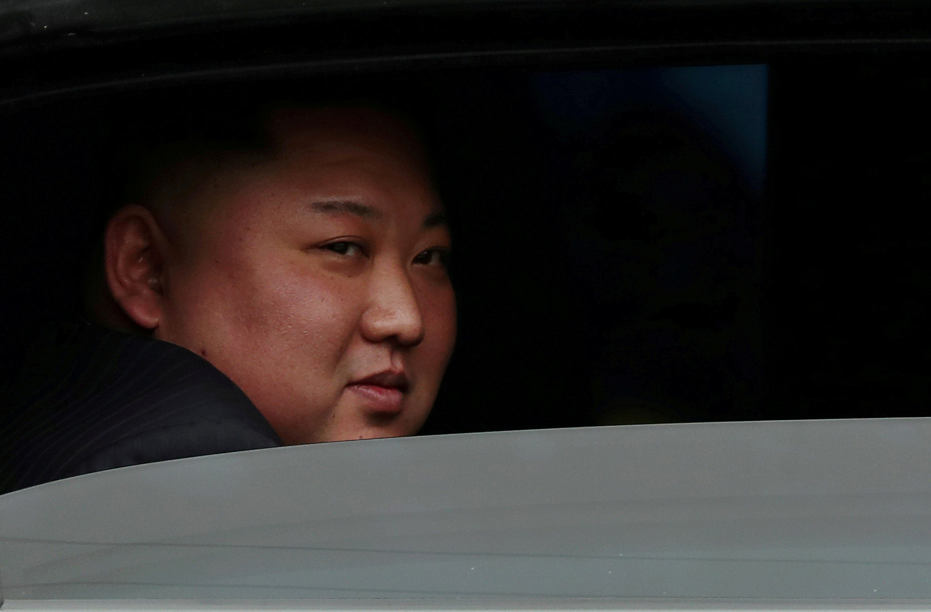 North Korea's leader Kim Jong Un sits in his vehicle after arriving at a railway station in Dong Dang, Vietnam