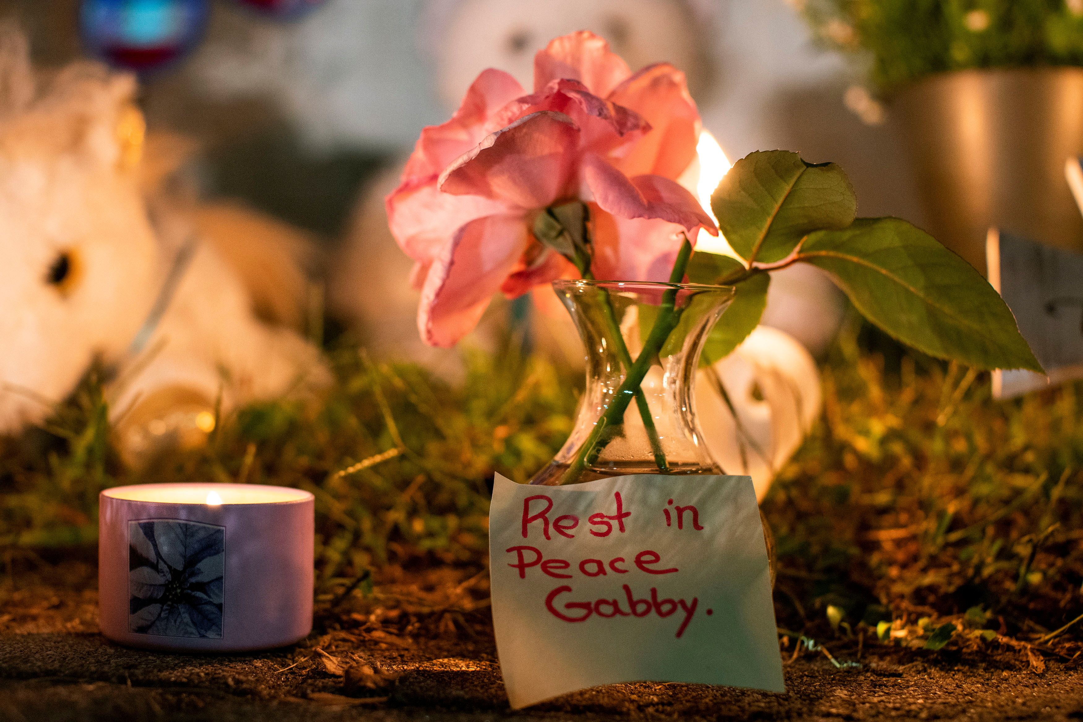 A note is seen in a makeshift memorial during a candlelight vigil for travel blogger Gabby Petito. REUTERS/Eduardo Munoz