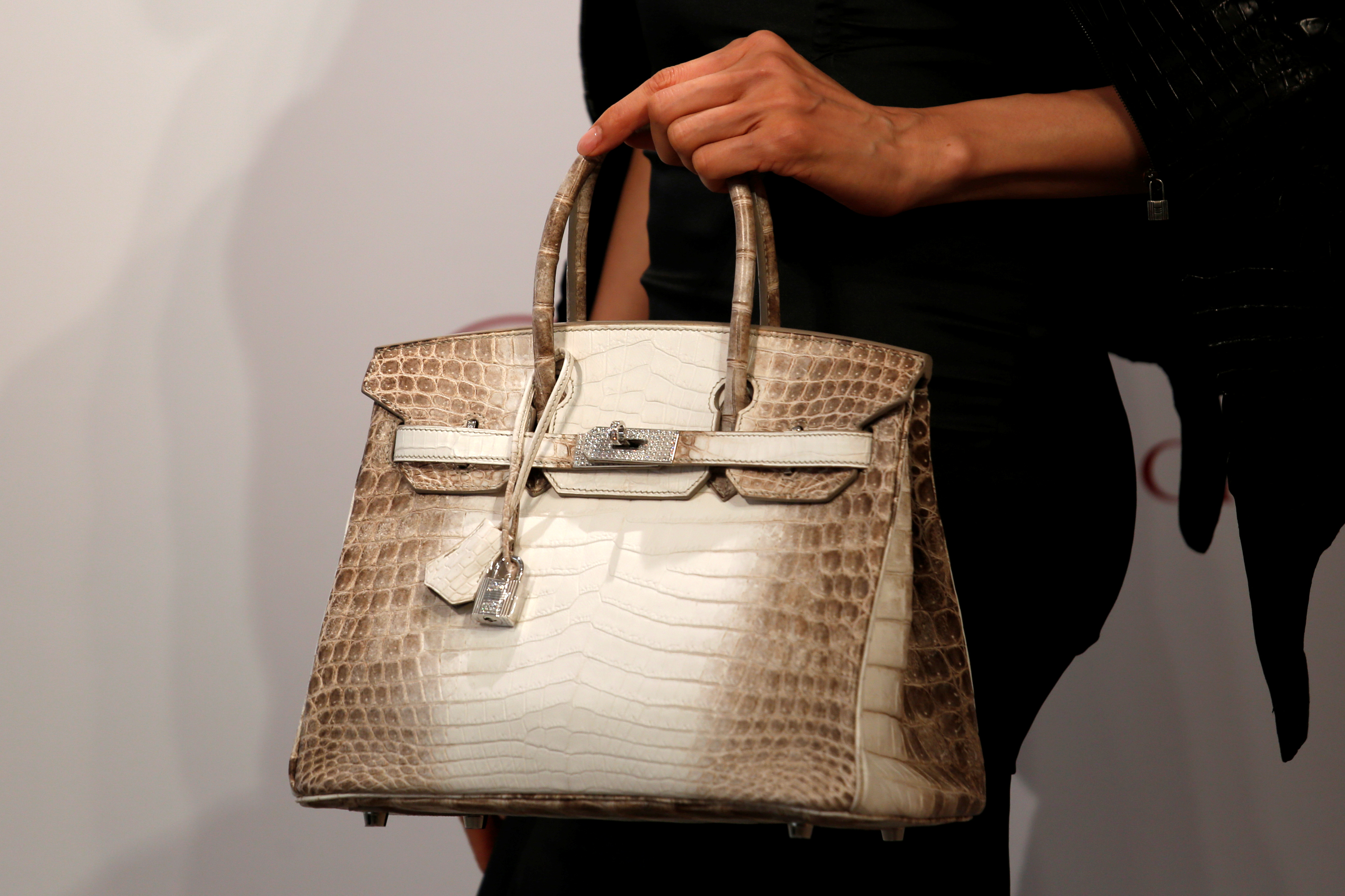 A model carries a Hermes signature Birkin with Himalayan crocodile leather during a preview in Hong Kong