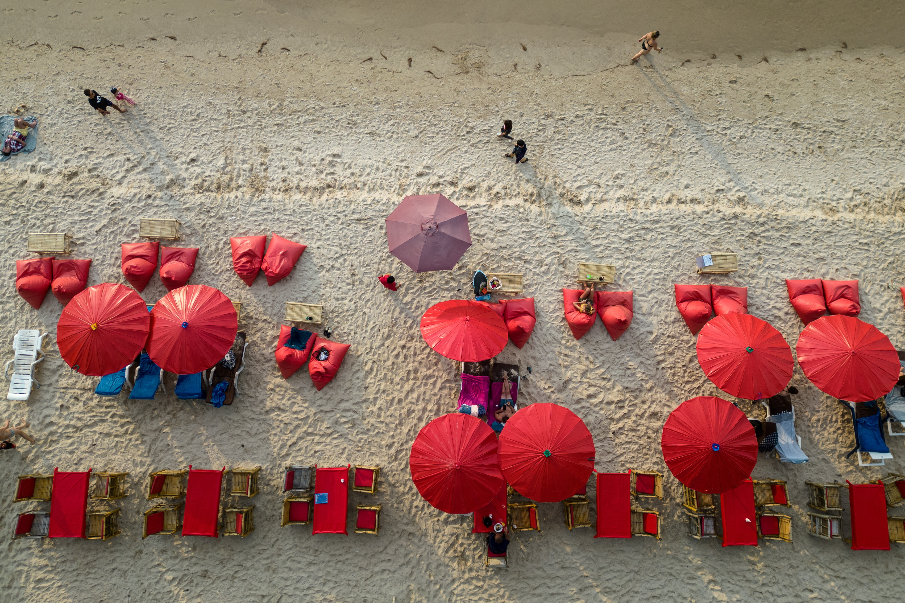 Umbrellas are seen in a restaurant as tourists enjoy a beach in the island of Phuket in Thailand