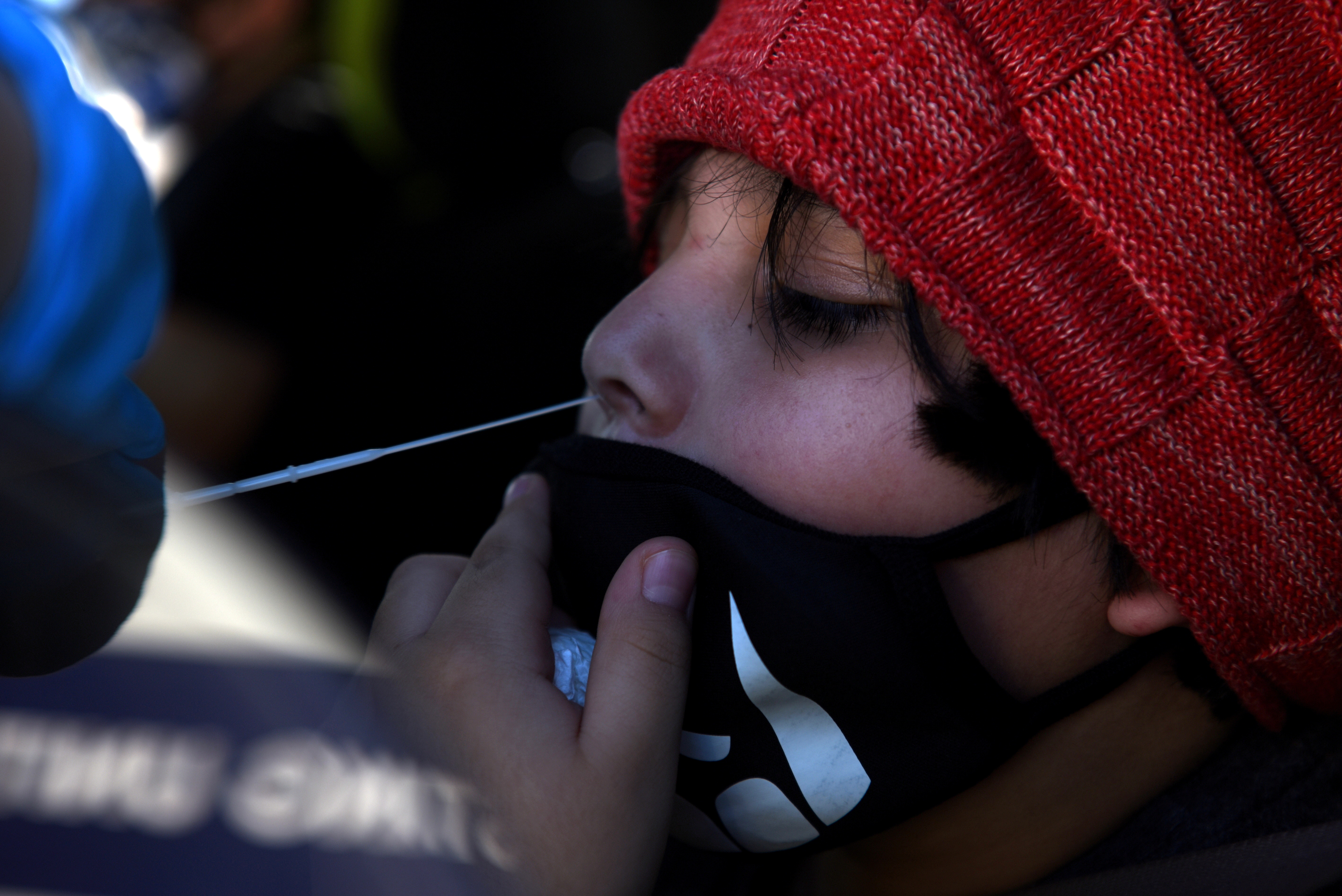 A young boy is tested for the coronavirus disease (COVID-19) at a mobile testing site as the country sees an increase in children infected with COVID-19, in Houston, Texas, U.S., August 16, 2021.  REUTERS/Callaghan O'Hare